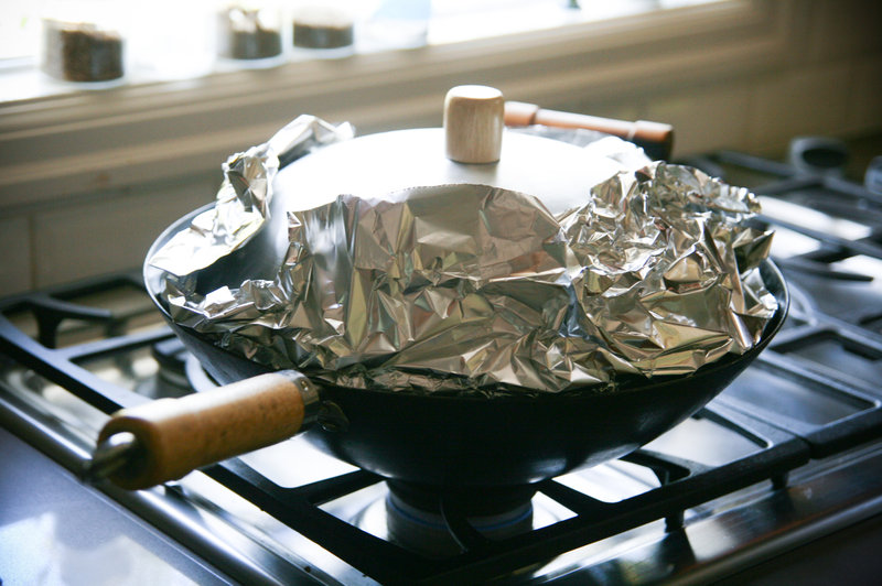 Coat everything with a full covering of foil — so that you end up smoking the fish, not the pan.