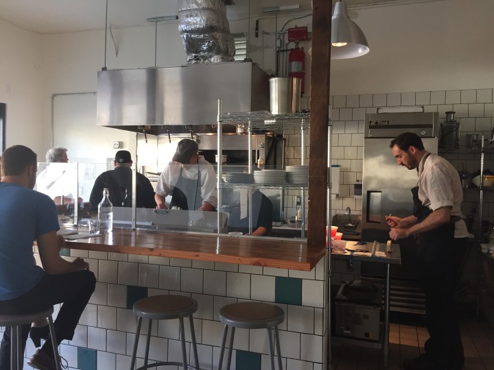 Chef Marcus Krauss (right) works in the open kitchen at Salsipuedes.