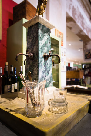 This drip fountain, on display at the Southern Food and Beverage Museum, is a replica of the one found at the Old Absinthe House in New Orleans. Drip fountains were an economical way to cool down water before adding it to absinthe, while also prolonging the spectacle of le louche.