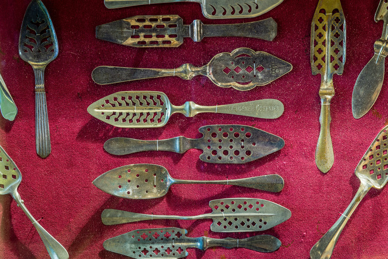 An assortment of slotted absinthe spoons from the late 19th century. They were mostly used in bars and absinthe houses in Europe.