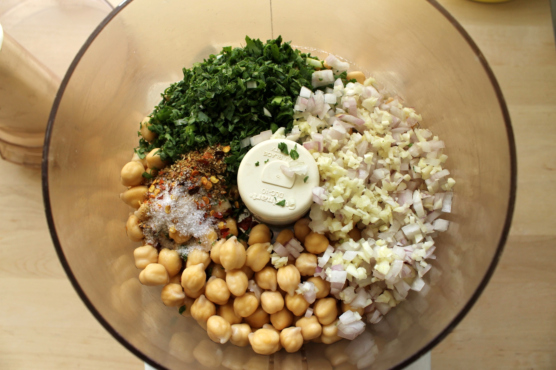 Combine the chickpeas with spices and minced aromatics.