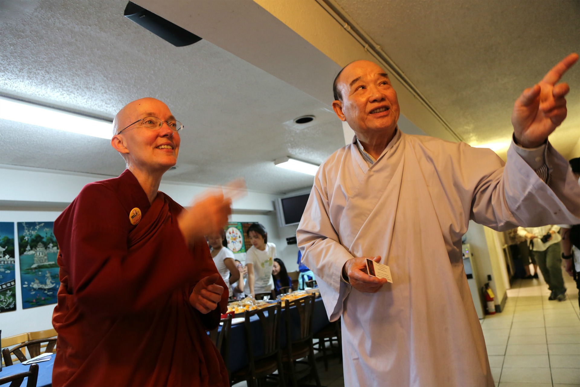 At Từ Quang Temple, walk leader Ayya Santussika Bhikkhuni talks to one of the original temple founders, Minh Huynh