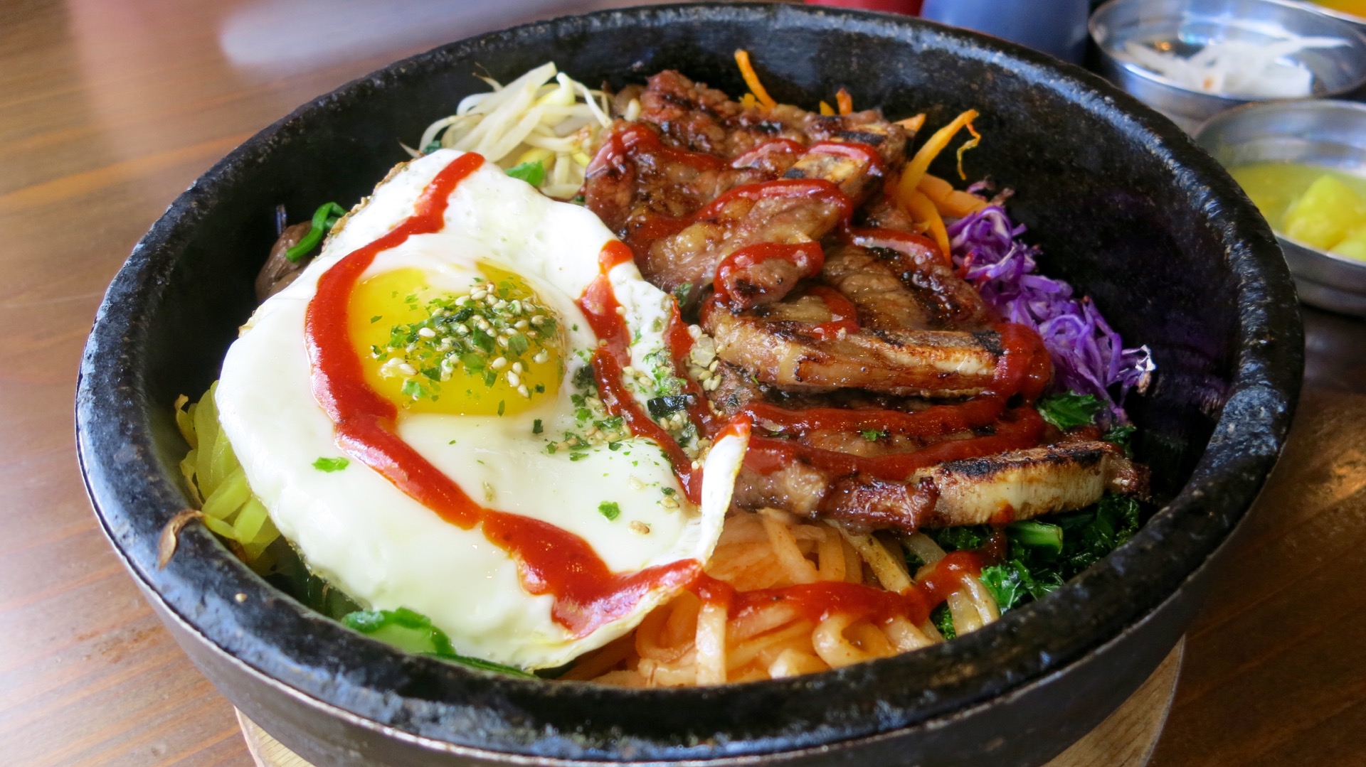 A symphony of sounds and flavors come with the sizzling dol sot bi bim bap at Bowl'd.