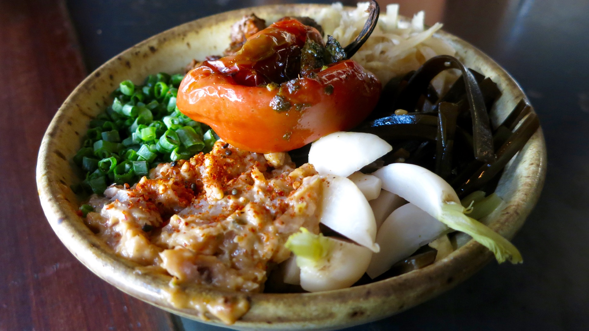 A recent donburi at Ramen Shop featured pork chashu and yellowfin tuna tonnato with charmoula-stuffed pimento pepper, scallions, ginger, kombu and sansho Tokyo turnips. 