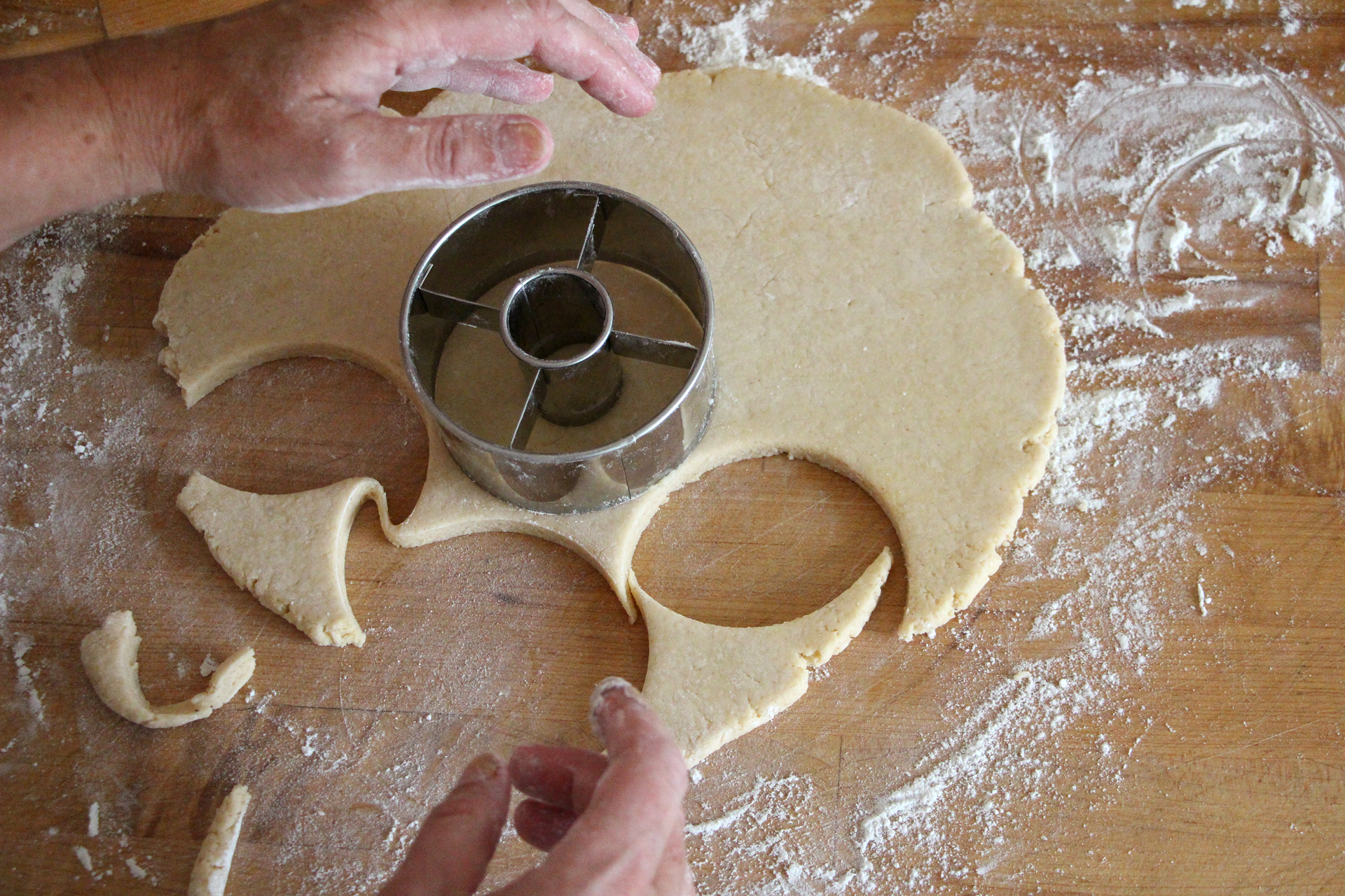 With a 3-inch-diameter donut cutter, cut out donuts and holes.