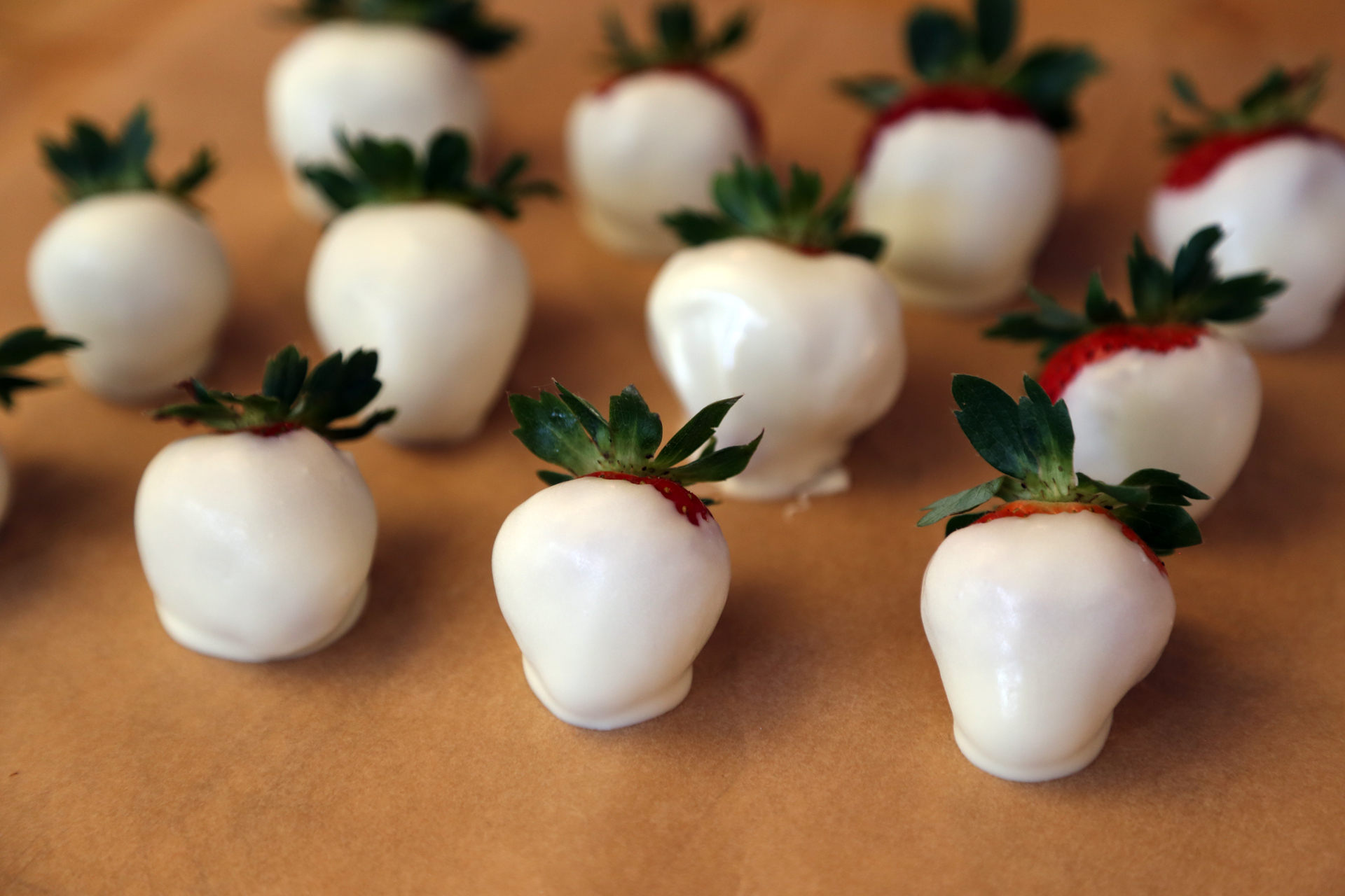Place the faceless strawberry ghosts onto the prepared sheet pan to set, about 30 minutes.