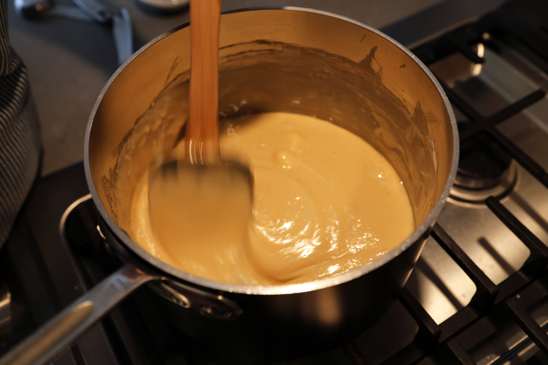 In a saucepan over medium-high heat, melt the butter. Add the sugar, cream, and corn syrup and cook, stirring, until mixture thickens and gets syrupy.