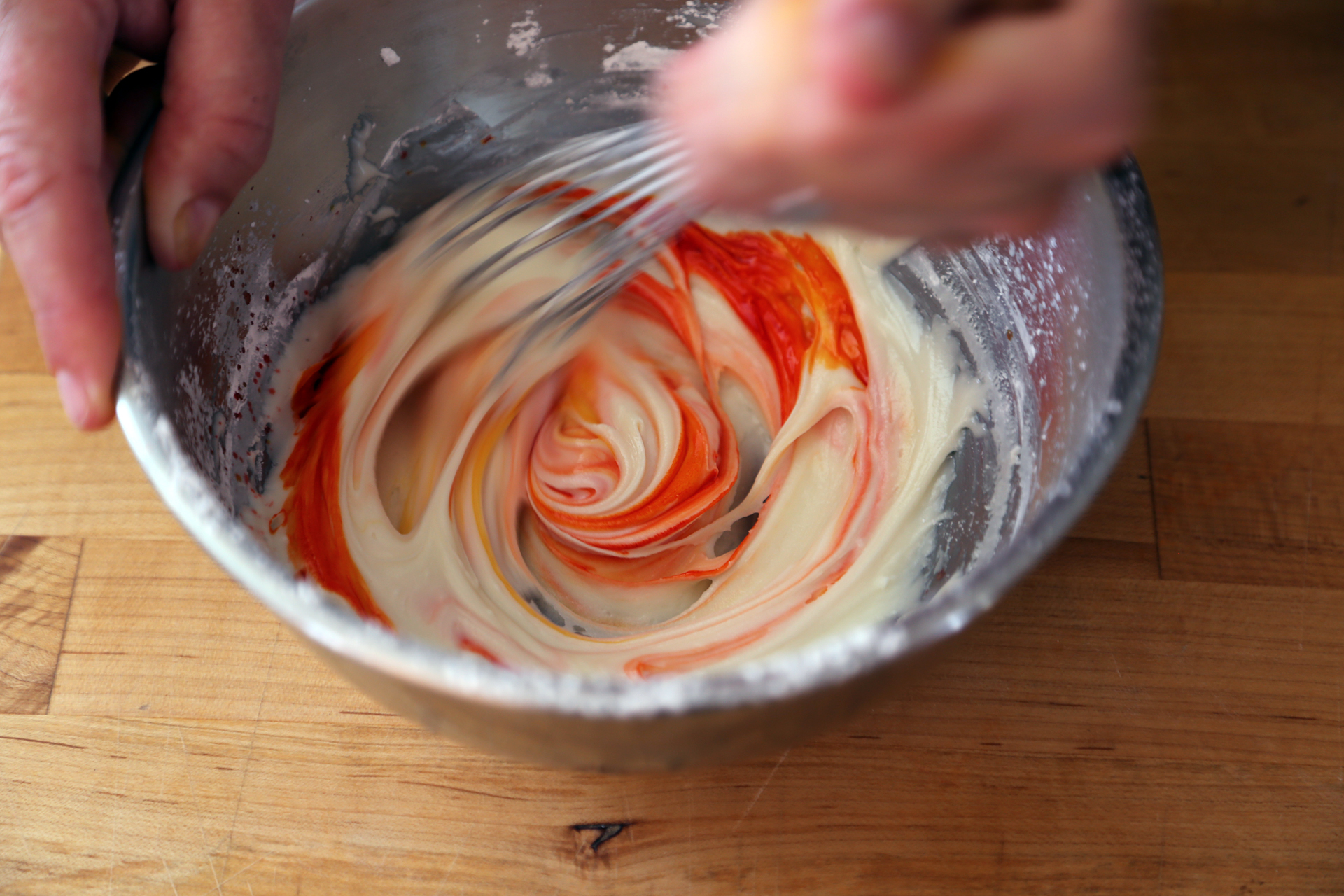 Color the icing with yellow and red food coloring to create orange icing. 