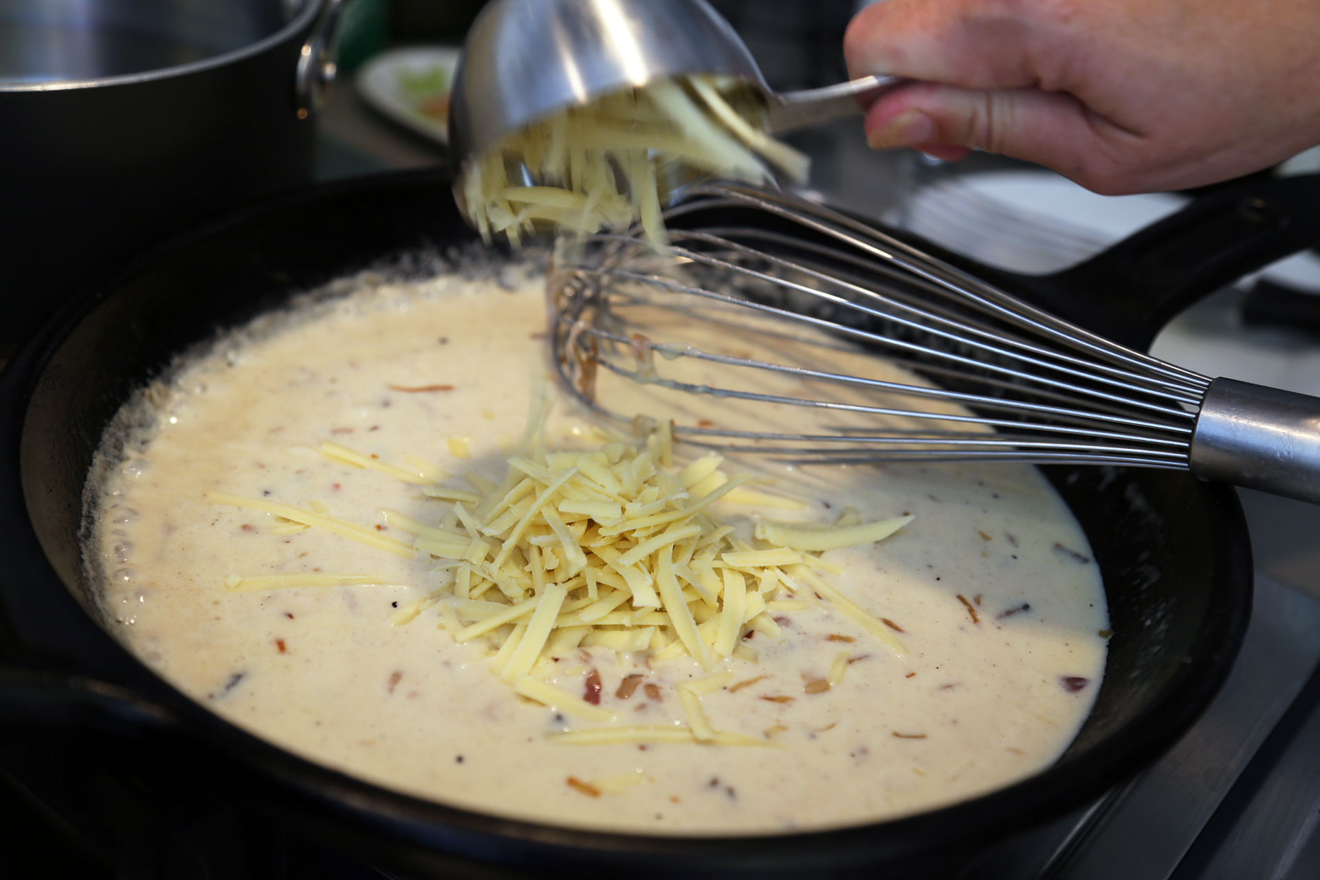 Add 1/2 cup of the cheese and stir until smooth. 