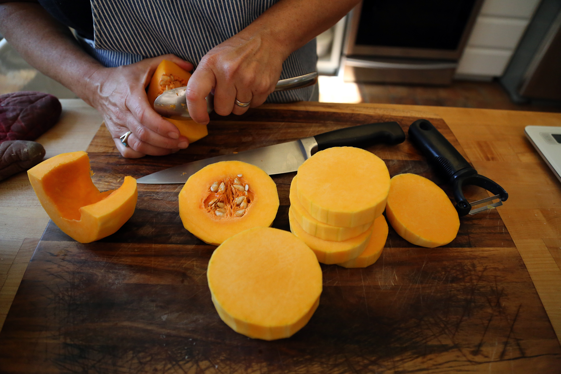 Slice the squash horizontally and scoop out the seeds. 