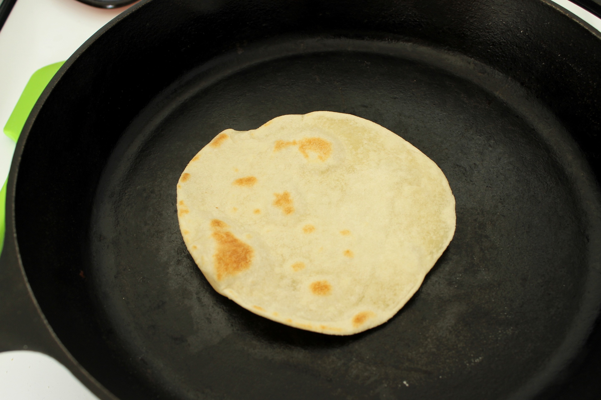 Each side of the tortilla should have golden brown spots.