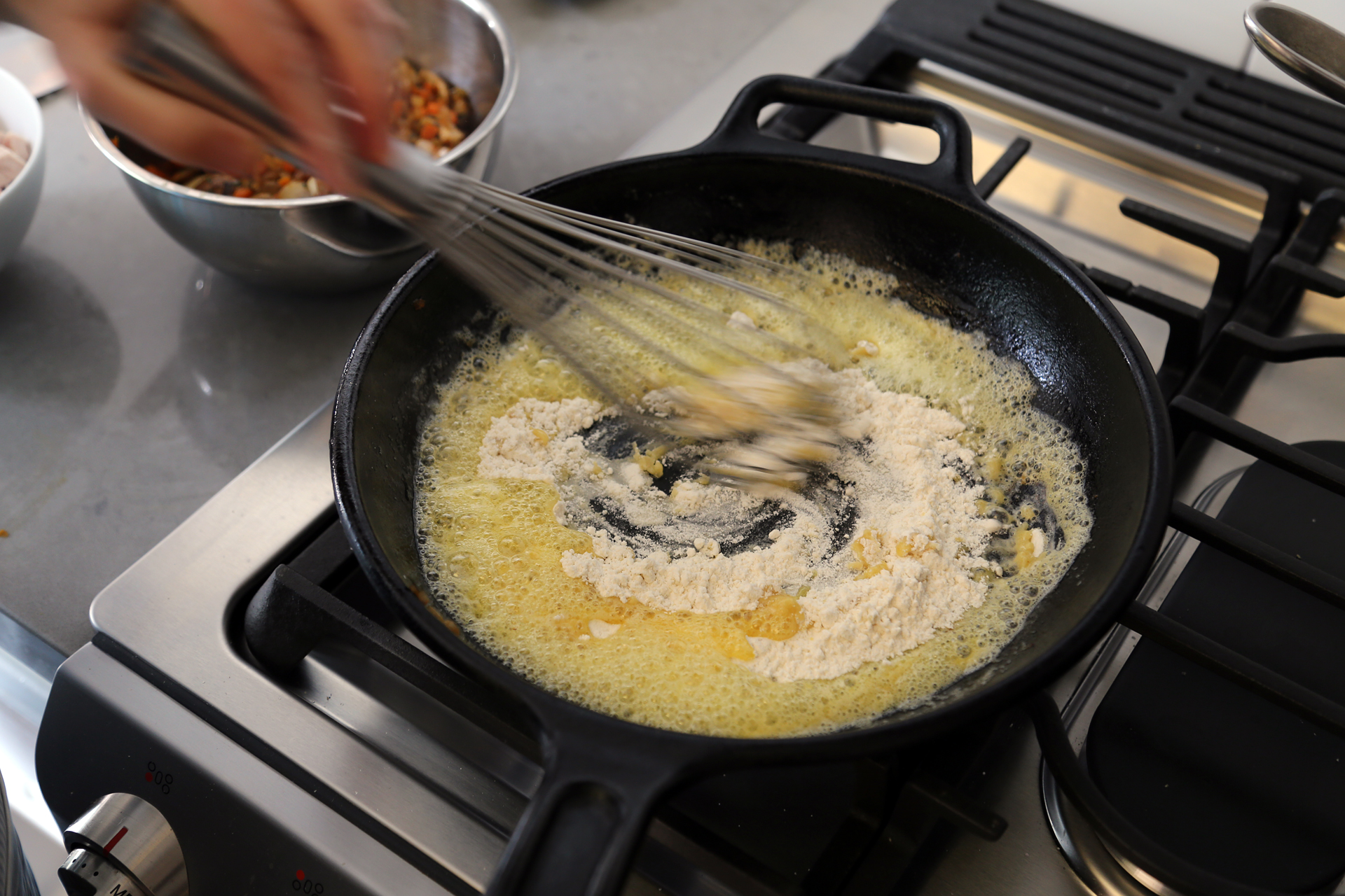 Add the remaining 5 tbsp butter to the frying pan. When melted, sprinkle in the flour. 