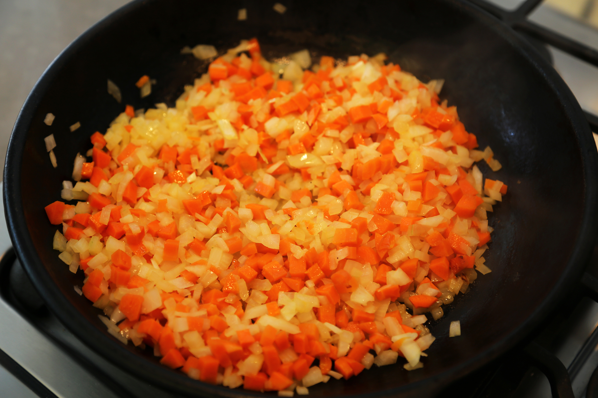  Add the onion and carrots and a pinch of salt. Cook, stirring, until tender and golden, about 10 minutes.