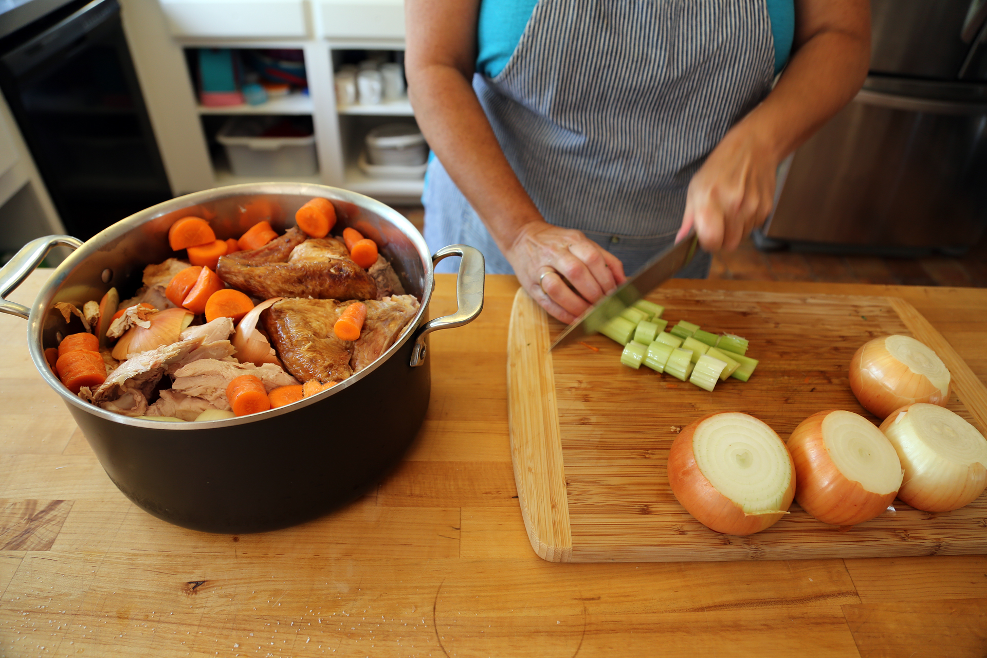 Prep the vegetables and add to the stock pot with the turkey carcass.