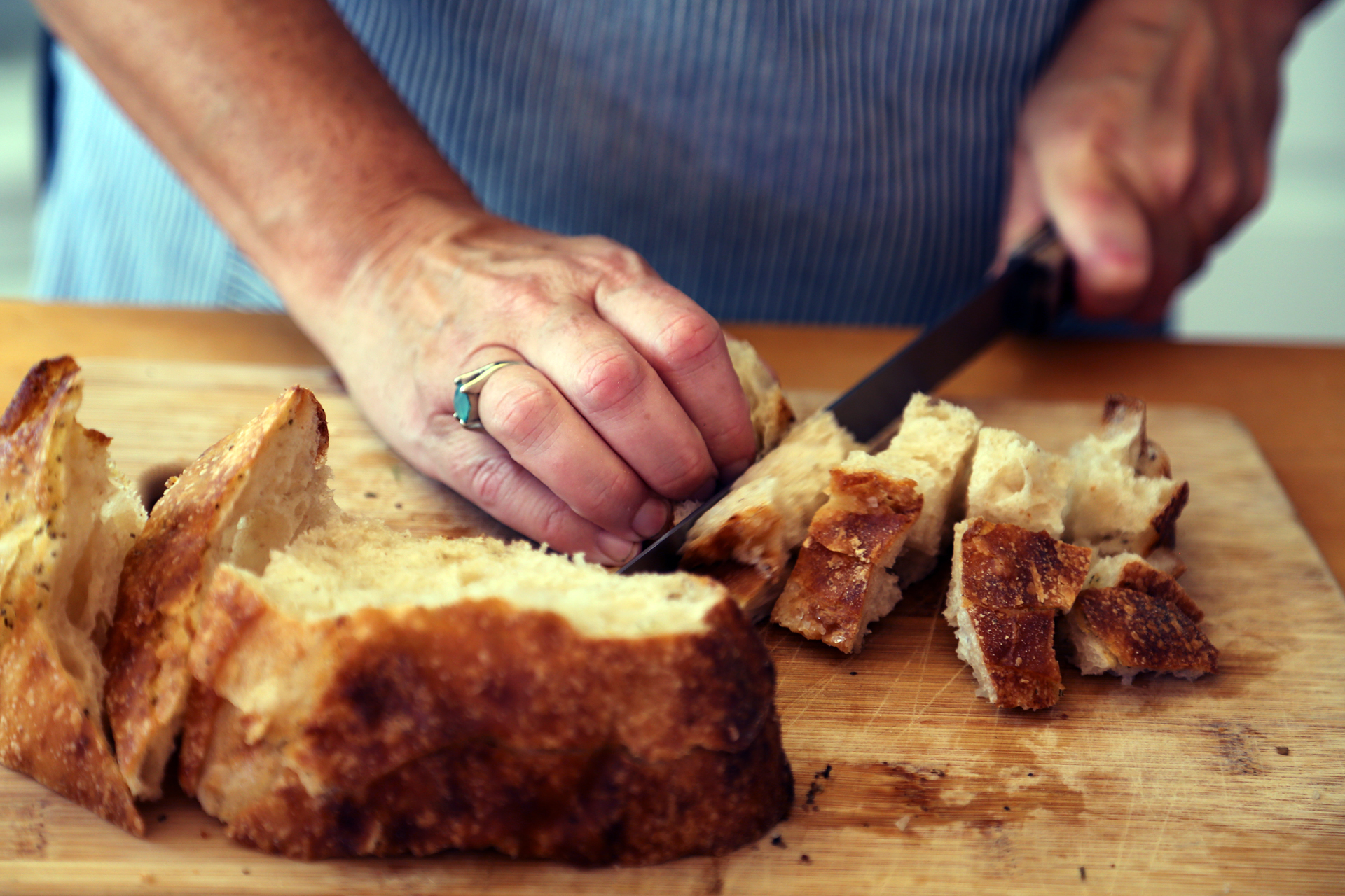 Cut the sourdough peasant bread into cubes and toast in the oven