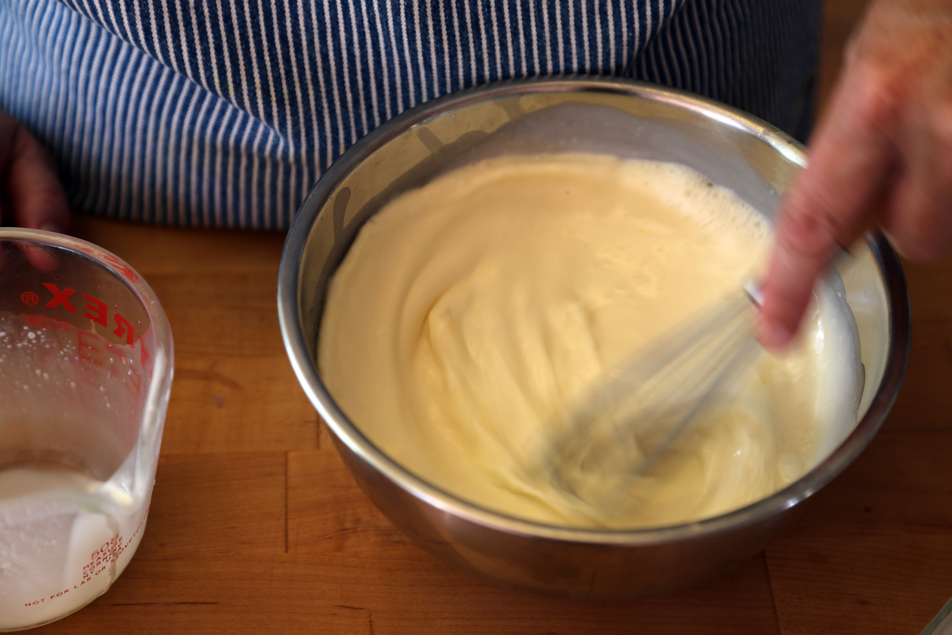 In another bowl, whisk together the chicken stock, cream, and eggs. 
