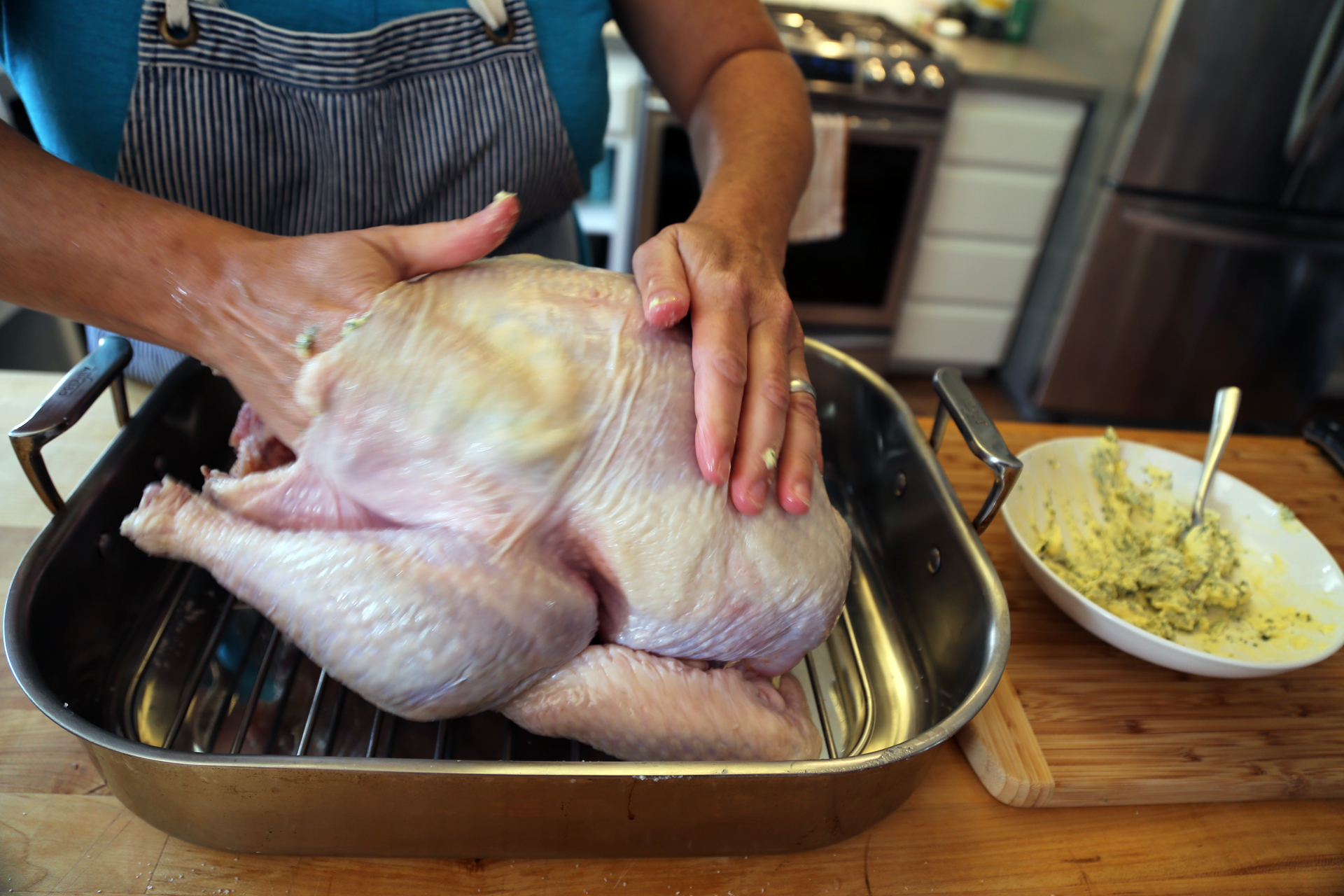 Rub the butter mixture under the skin and over the top of the skin.