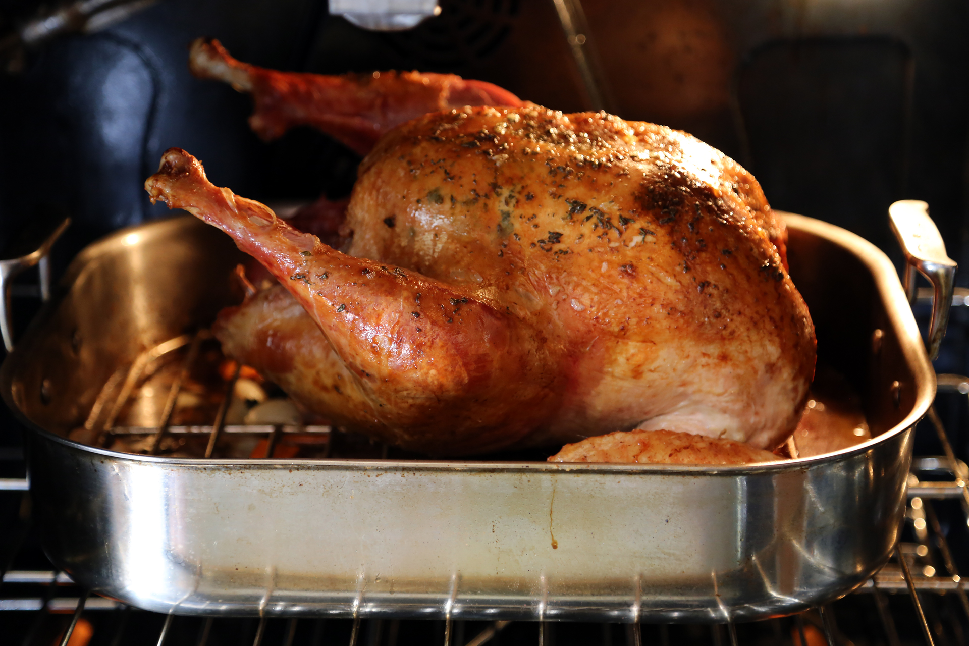 Remove the turkey from the oven and carefully turn the bird breast side up. Continue to roast until the temperature reads 165F in the thickest part of the breast away from the bone or 170F in the thickest part of the thigh away from the bone.