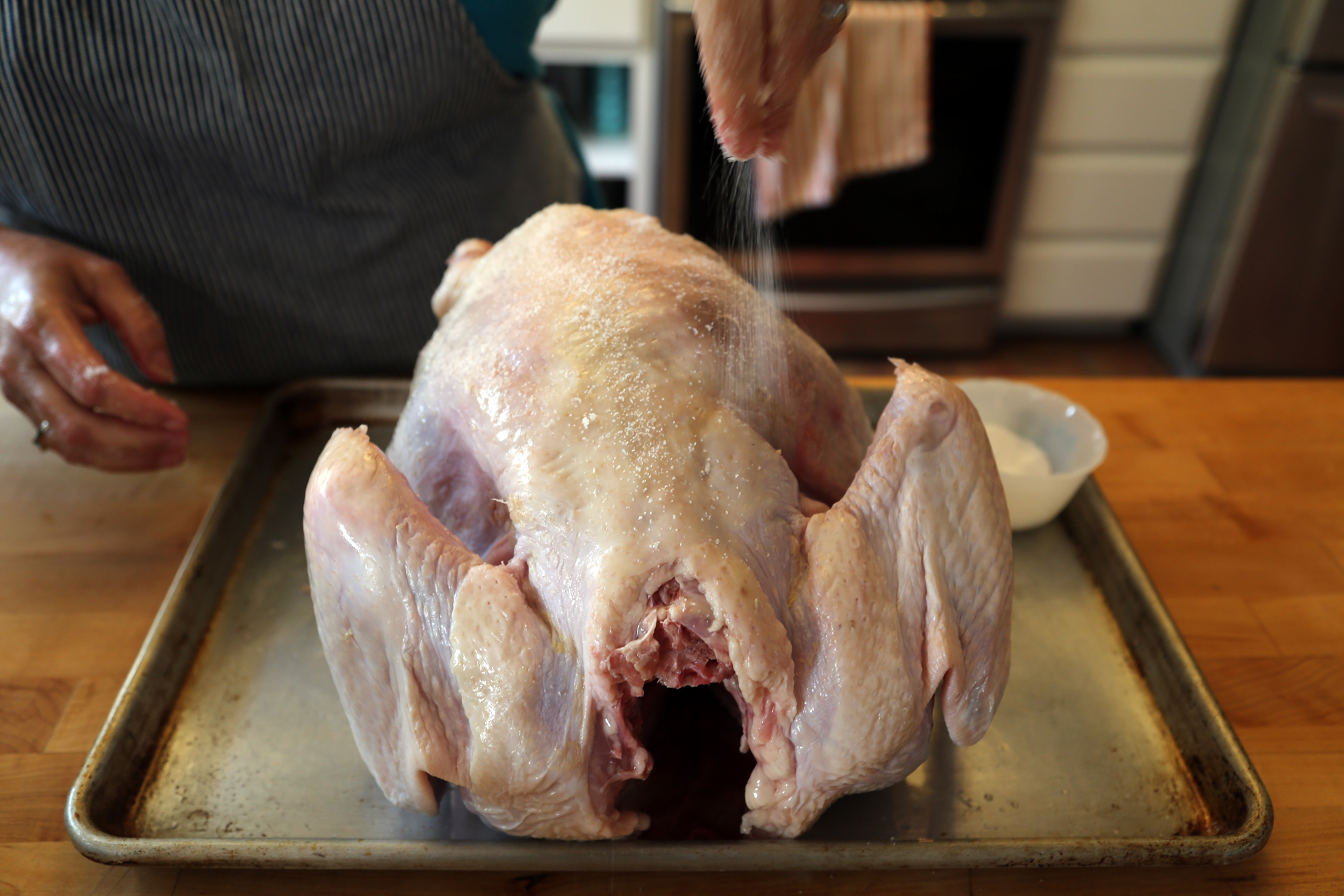 Rub the turkey all over, inside and out, under the skin and over the skin, with plenty of kosher salt and then let it sit and let the salt work its magic.