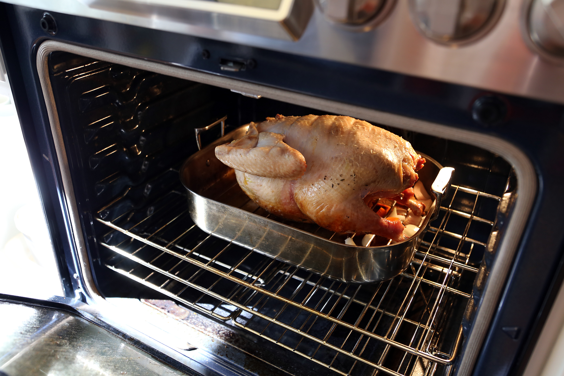 Turn the bird upside down to brown the bottom. Continue to roast, basting the turkey occasionally with the pan juices, for 1 more hour.