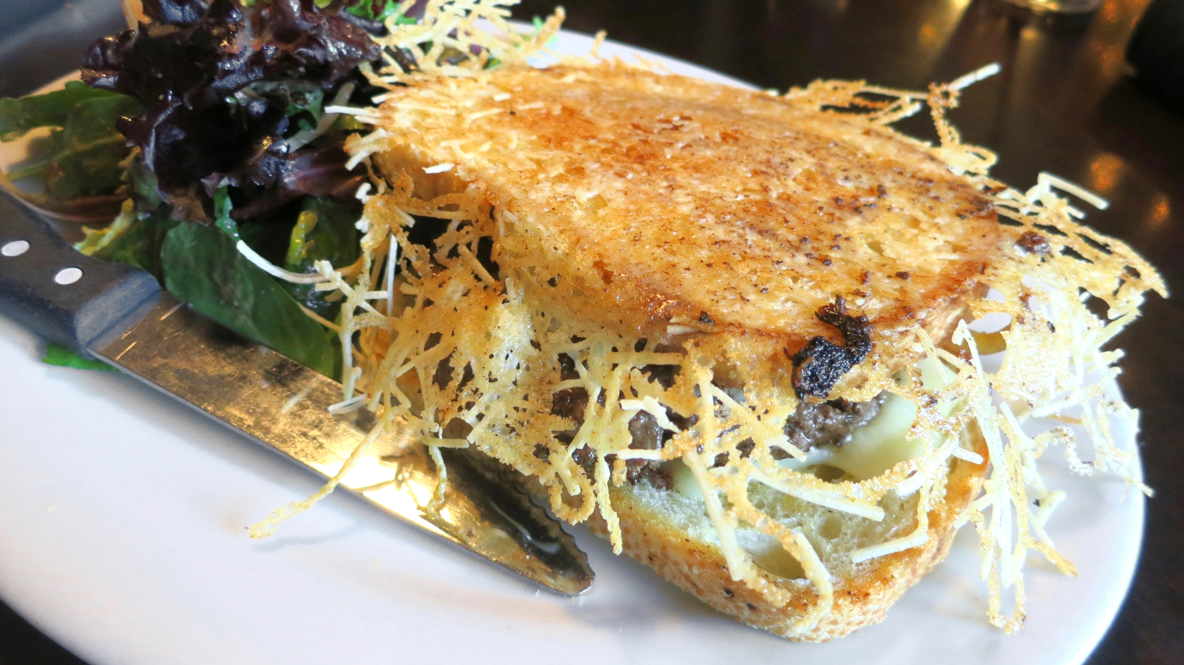The Peasant Courtyard's Parmesan-encrusted patty melt is a real show stopper.