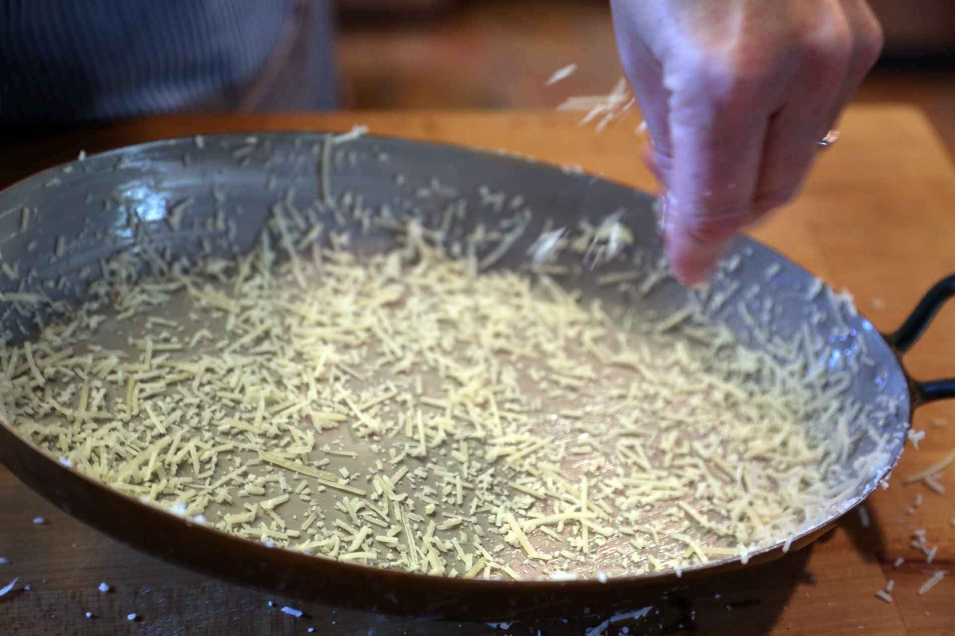 Grease a 2-quart shallow baking dish with the butter, then sprinkle with the Parmesan.
