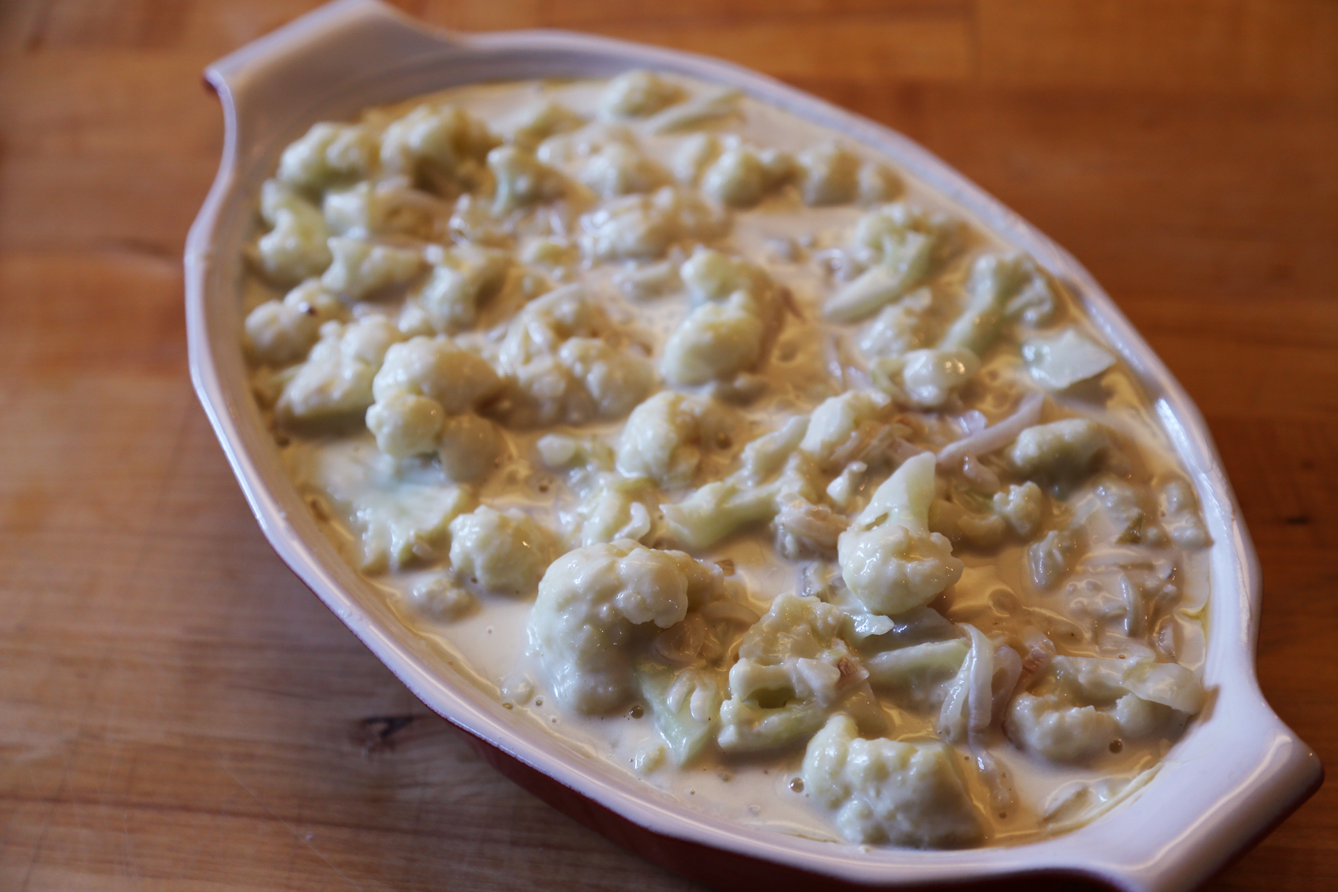 Grease a 2-qt gratin dish or baking dish. Spread the cauliflower mixture into an even later in the dish. 