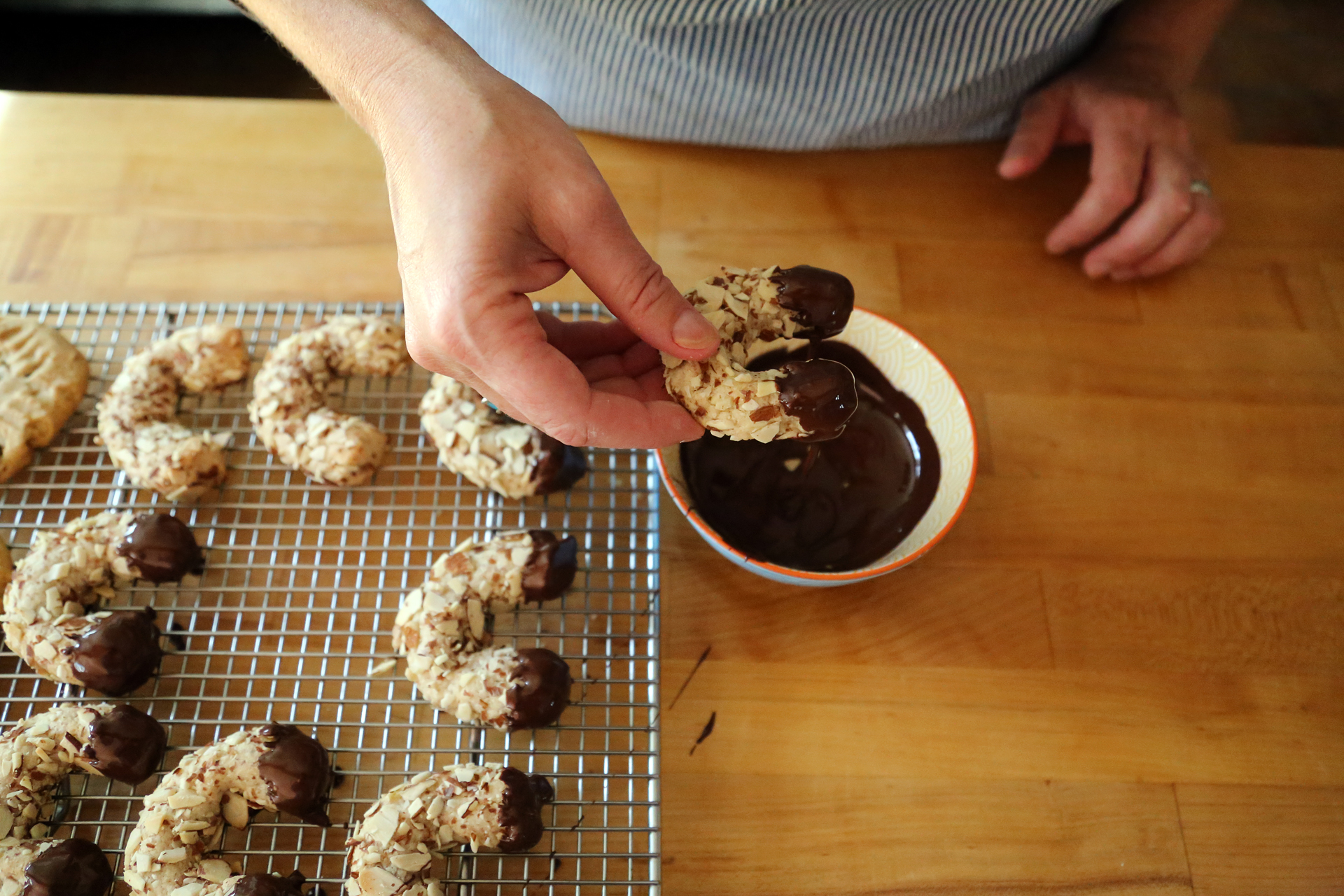 Dip the ends or the base of the cooled cookies into the chocolate, then let dry on parchment, waxed paper or a wire rack.