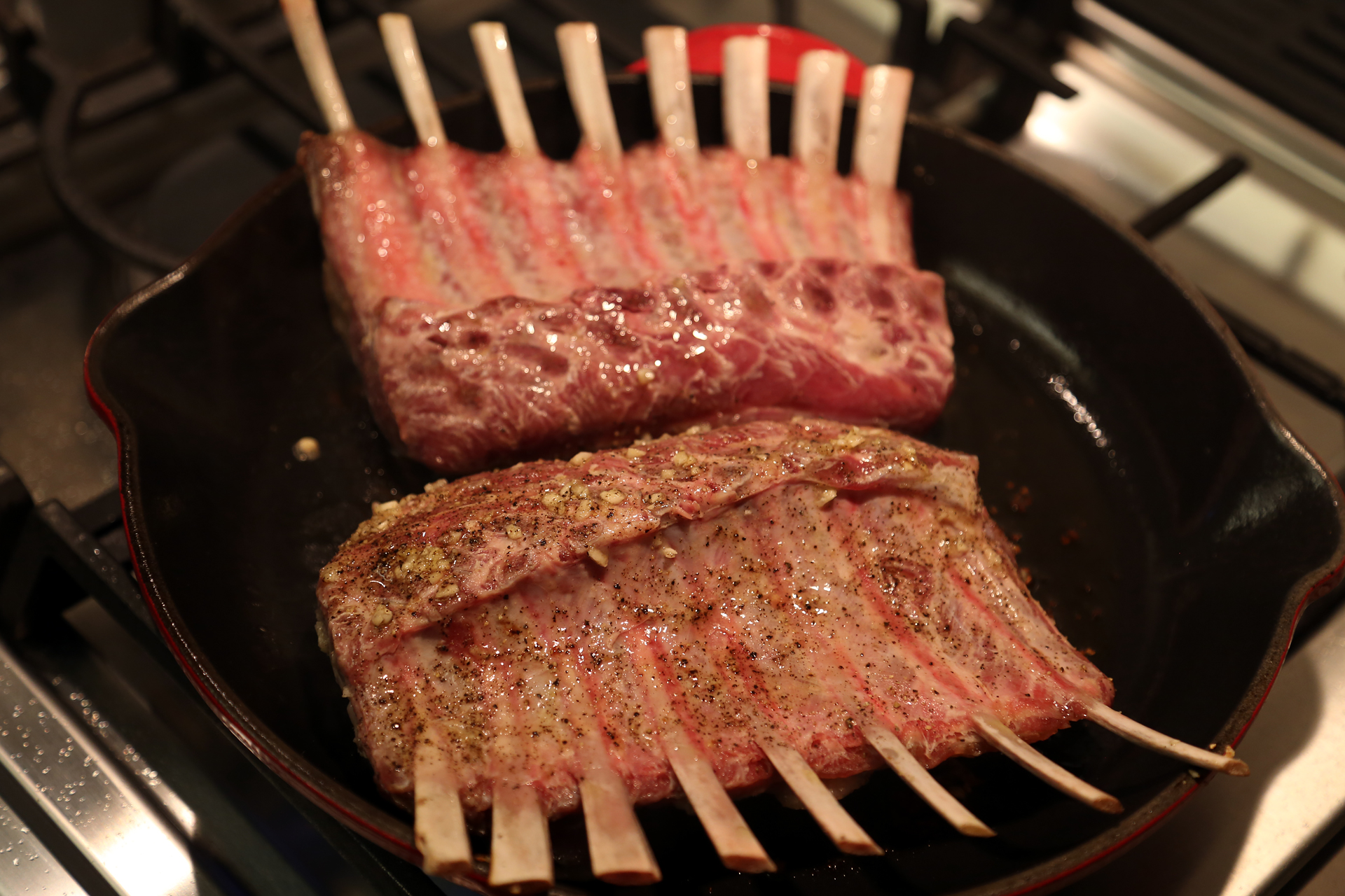 Add the racks, fat side down, and sear until browned, turning once or twice, about 5 minutes.