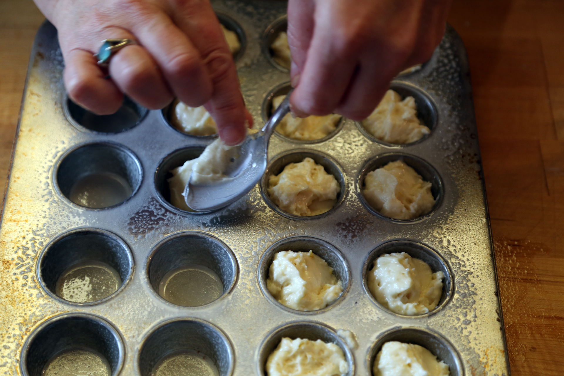 Divide the batter between the muffin cups, filling them nearly full. You should fill about 38 cups. 
