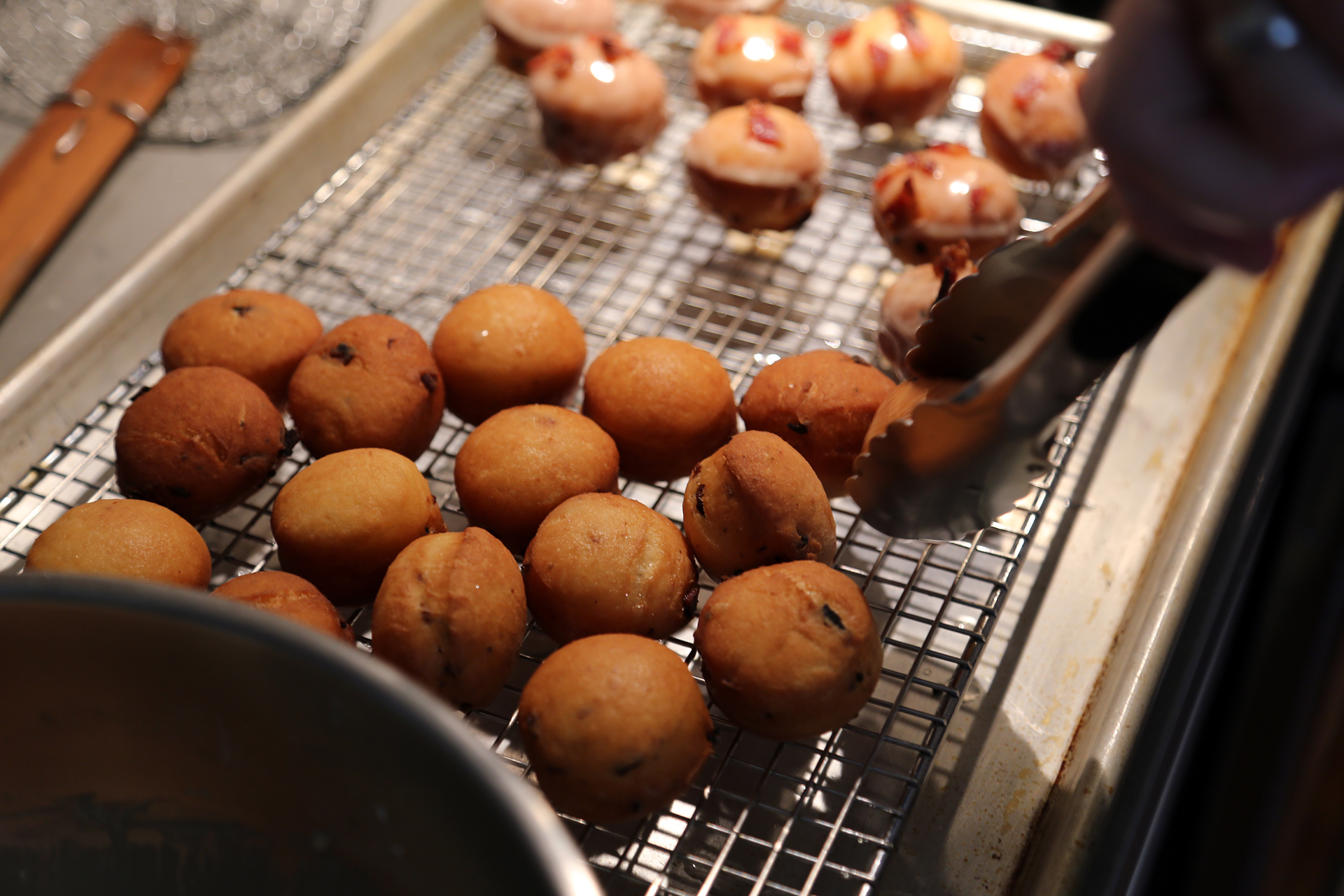 Remove the donuts, drain on a wire rack over a paper towel, and let cool slightly before glazing.