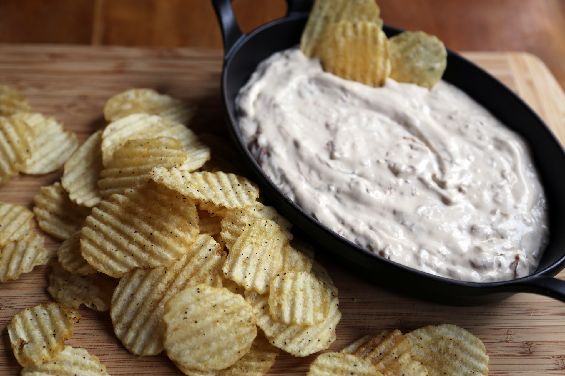 Season with salt and pepper and serve with the potato chips alongside for dipping.