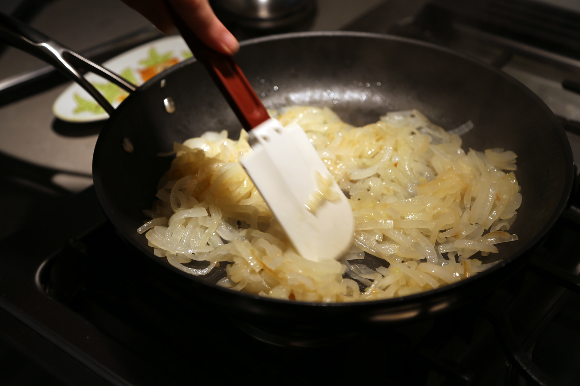 Add the onions and a big pinch of salt, cover the pan, and cook, stirring occasionally, until golden brown and softened,