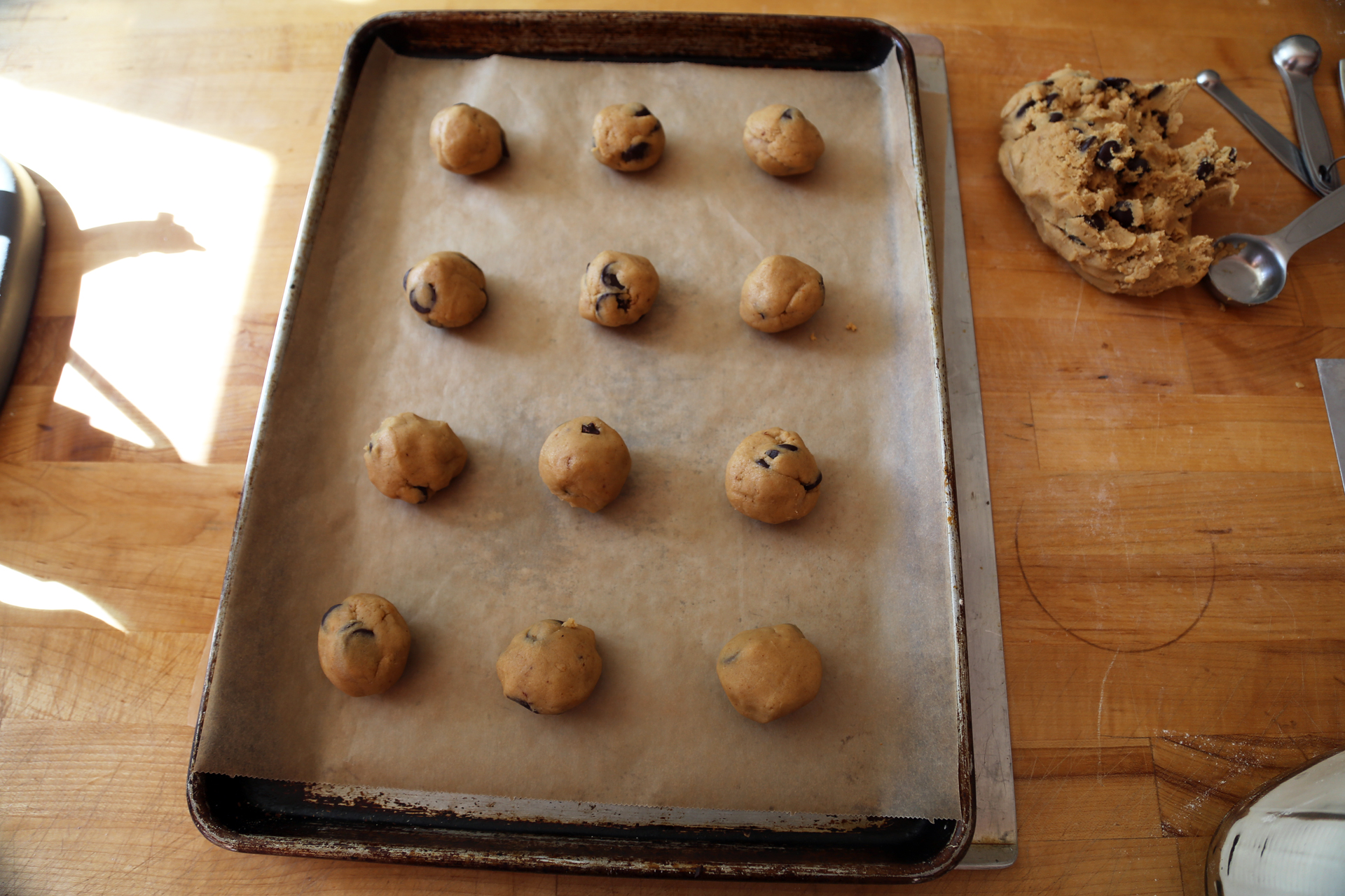 Roll tablespoonfuls of the dough into balls and space evenly on the baking sheets.