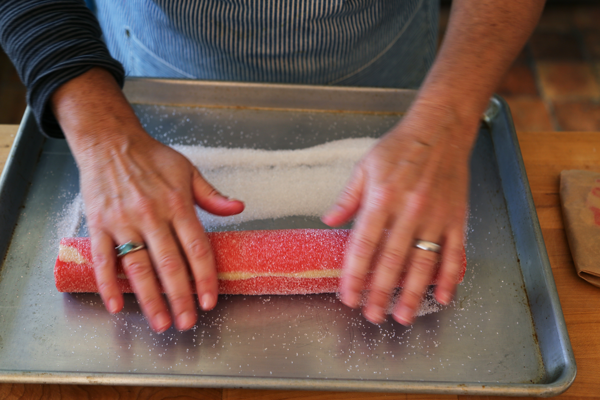 Roll the log in the sparkle sugar, pressing slightly to make sure it adheres to the dough.