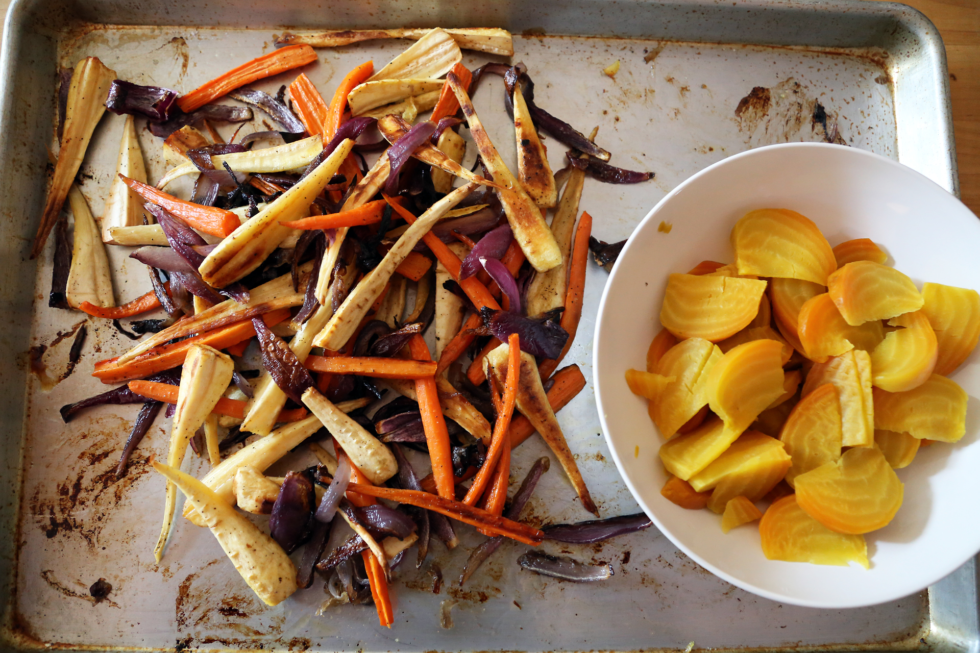 Roast the vegetables until just tender, about 40 minutes, turning occasionally for even cooking. Let cool to room temperature on the pan.