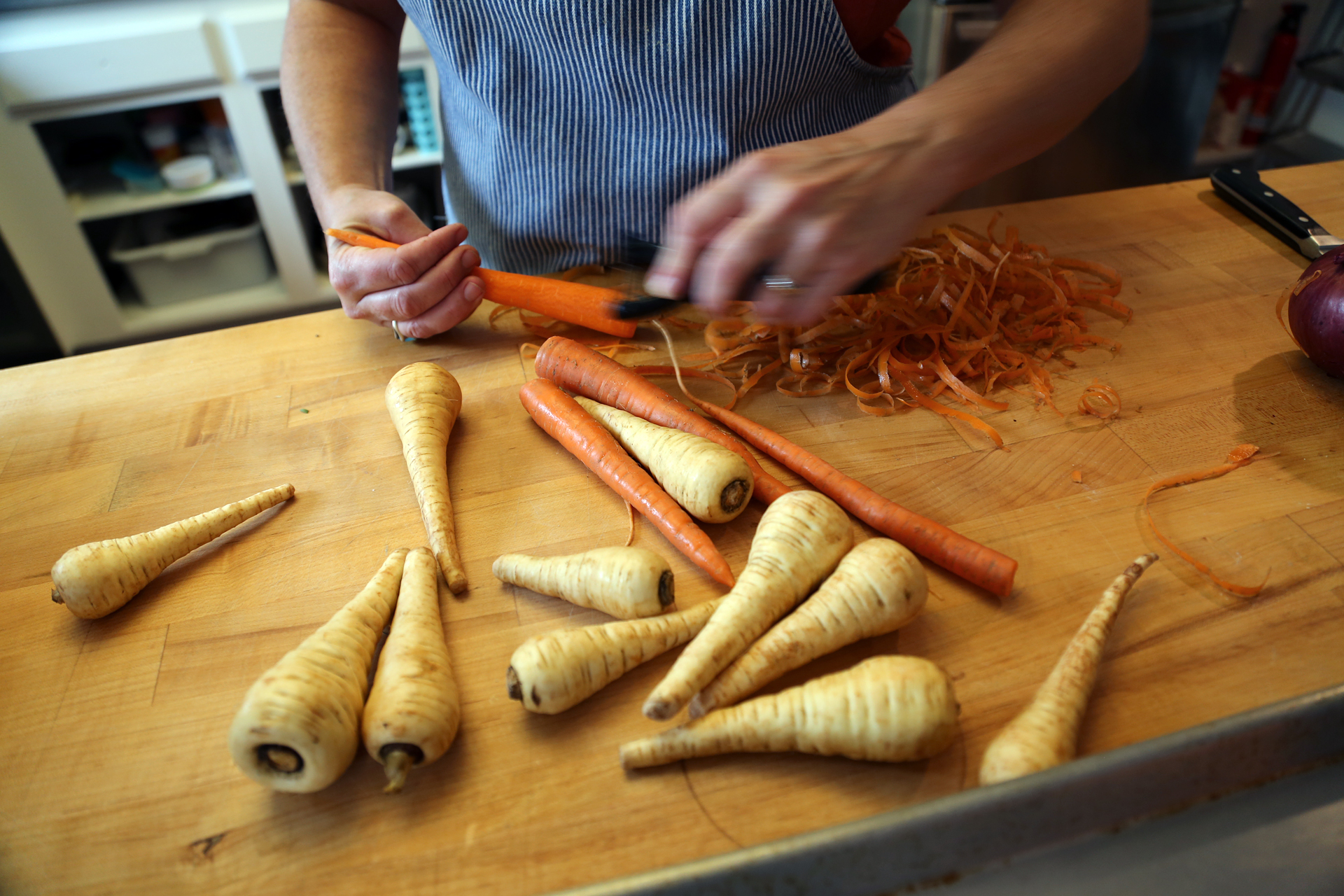 Trim and peel the carrots and parsnips.