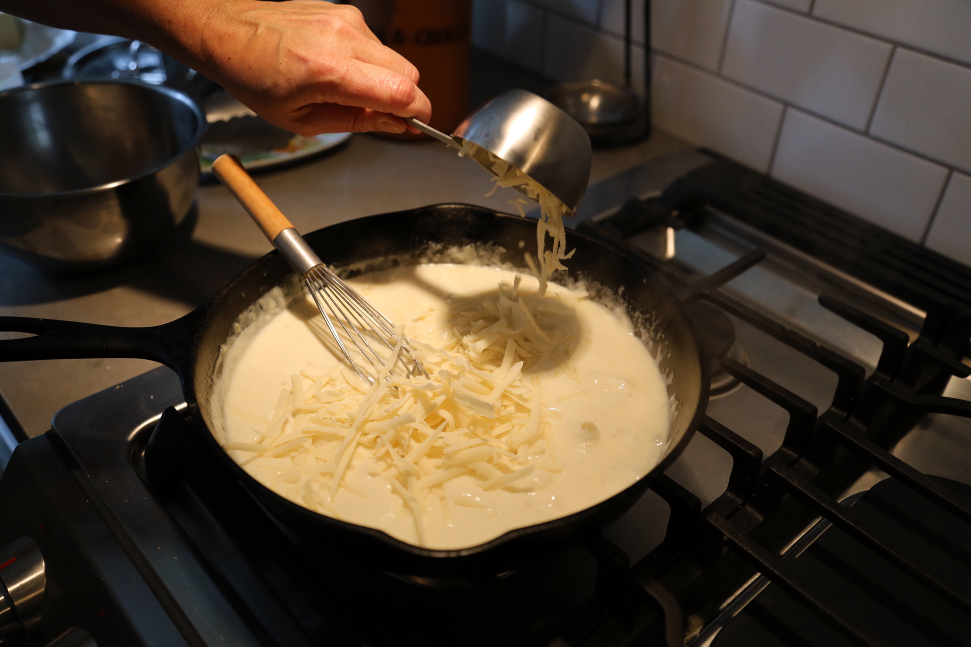 After the sauce thickens, sprinkle in the gruyere, stirring until melted and smooth.