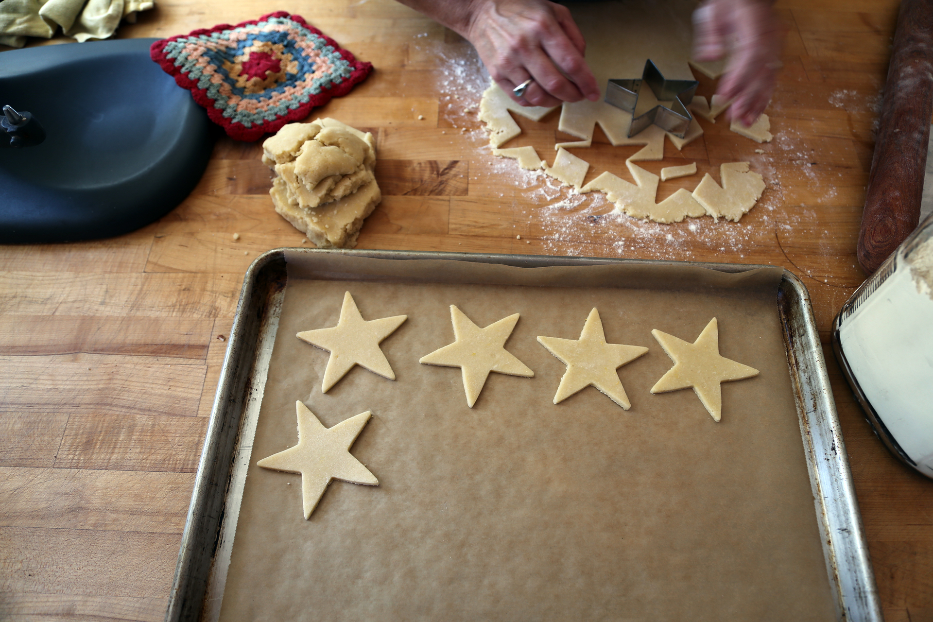 Using a 3 1/2-inch star-shaped cookie cutters (or the cutters of your choice), cut out as many rounds as possible, spacing them slightly apart.