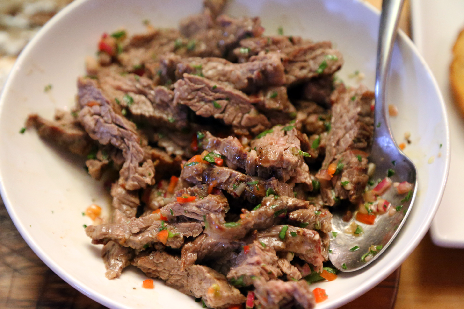 Toss the steak slices in a bowl with a few tbsp of the chimichurri sauce.