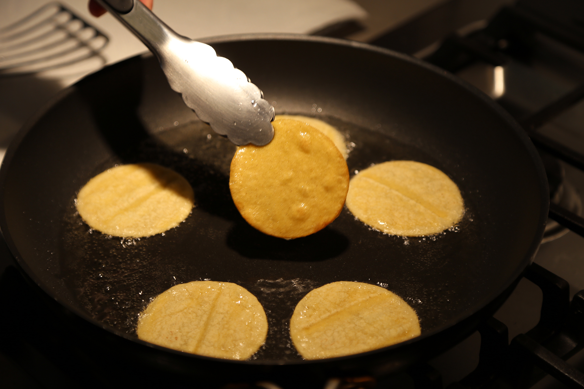 Fry the tortilla rounds until crisp.Transfer to a wire rack lined with paper towels and set over a baking sheet to drain.