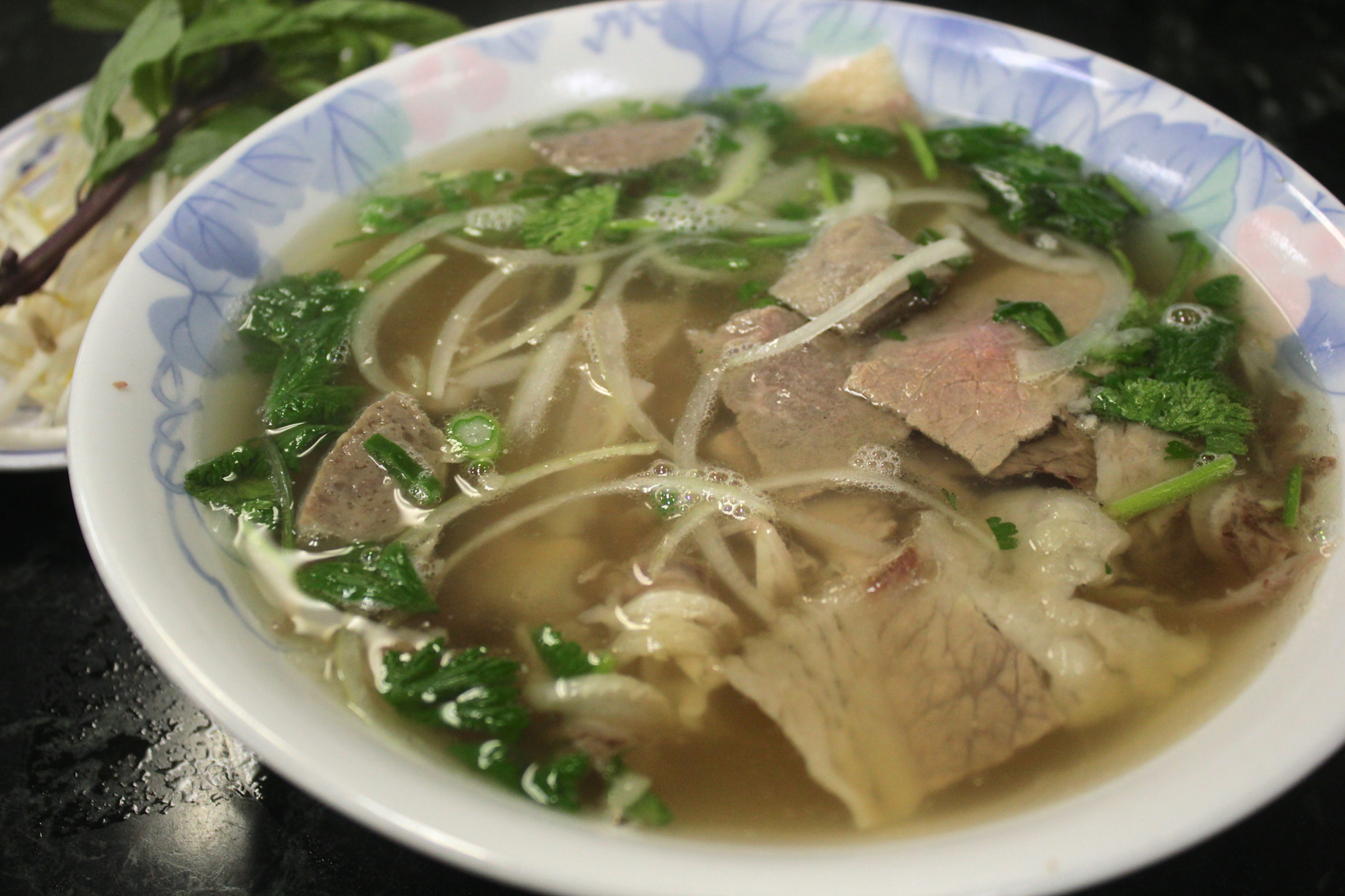 Pho Y special with eye of round steak, well-done flank, fatty brisket, soft tendon and meat ball.