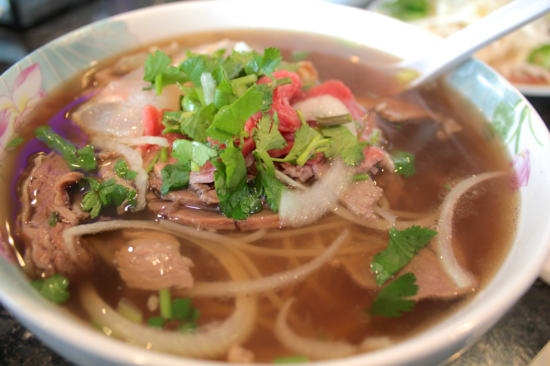 The popular #8 combination pho with rare filet mignon, well-done brisket, flank and tendon.