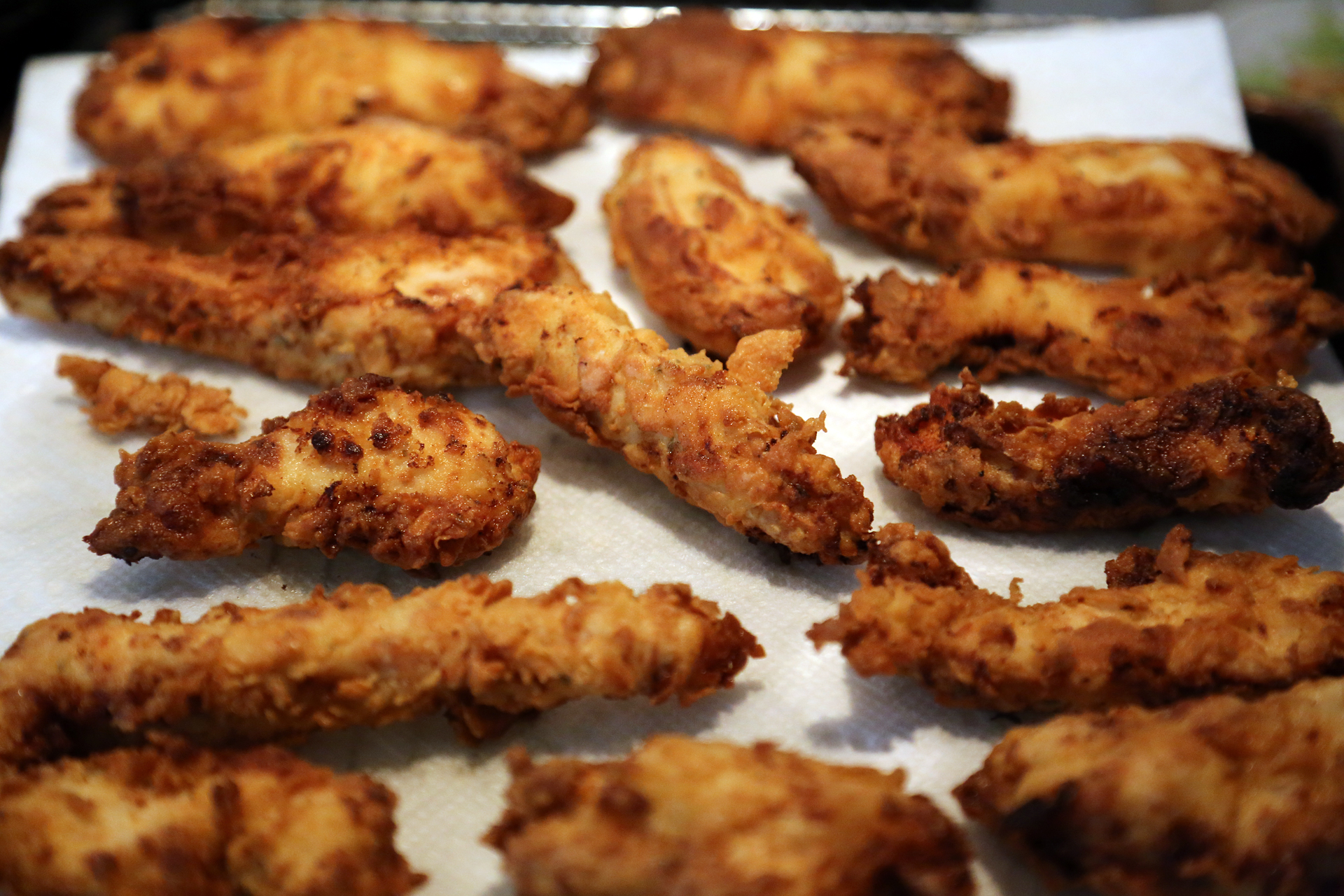 Transfer to the rack in the oven to keep warm while you finish frying the remaining chicken fingers.