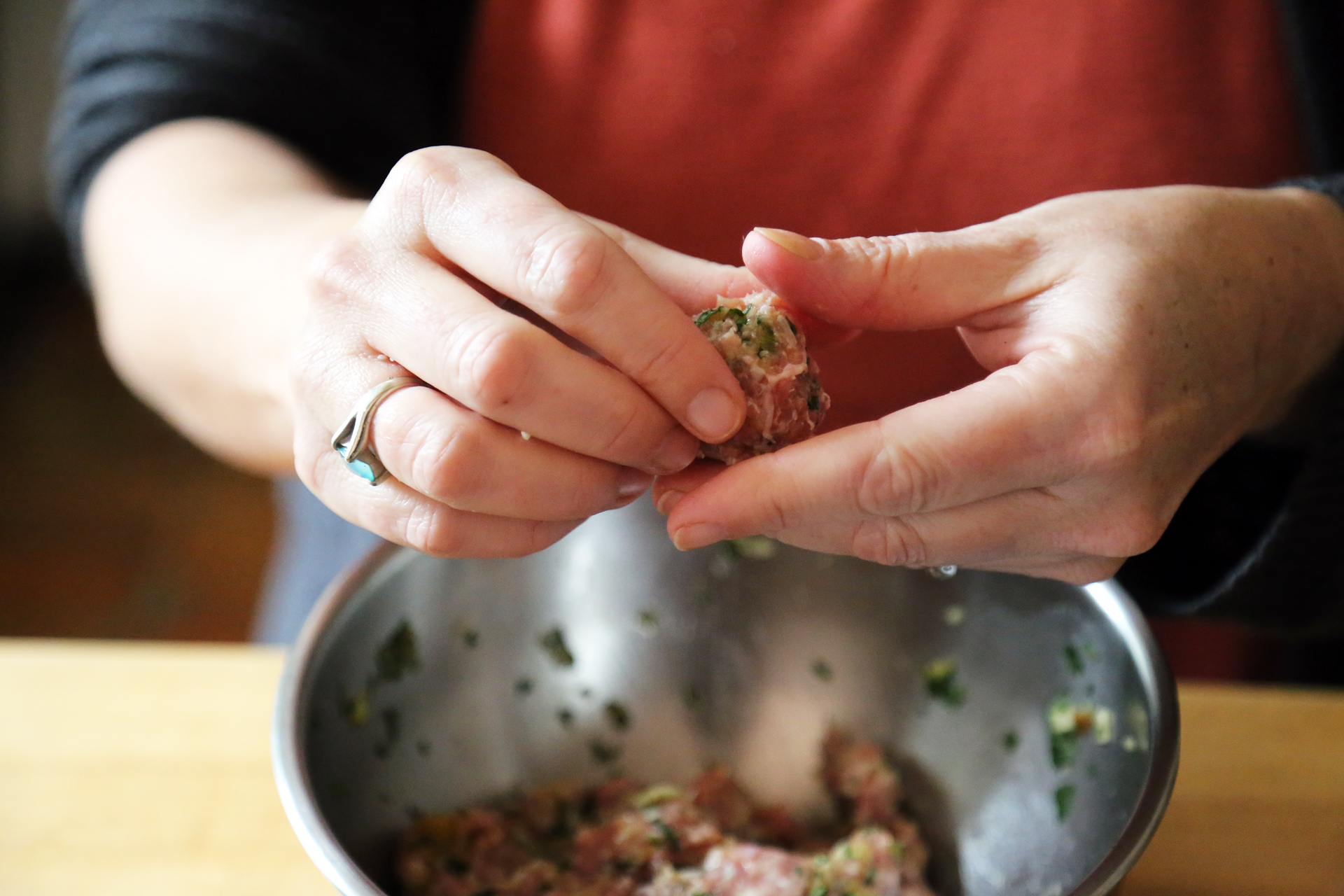 Using tablespoon measure, roll the mixture into meatballs.