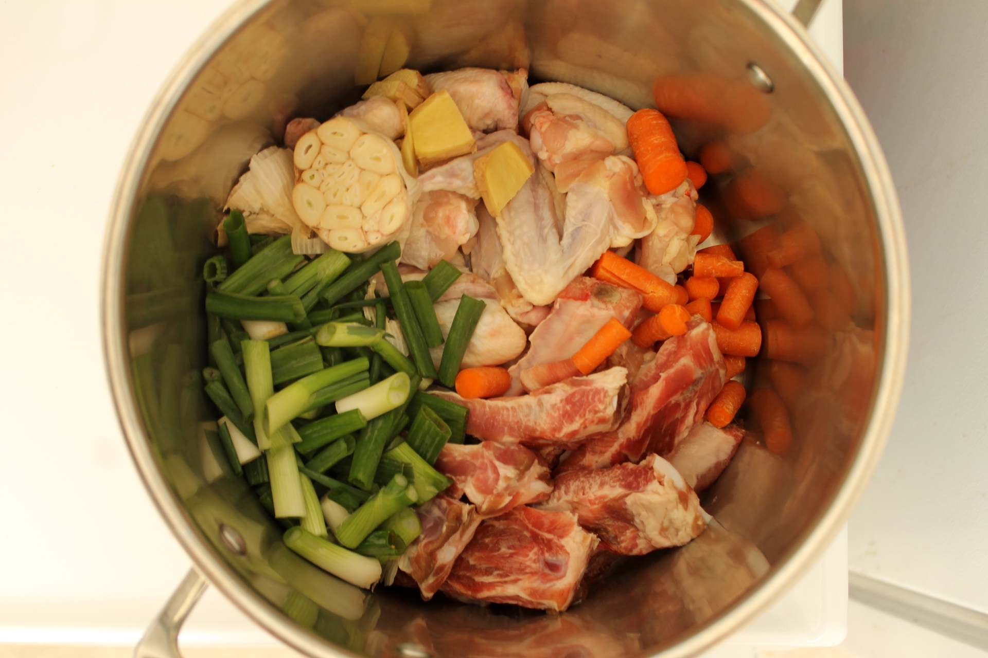I make my ramen broth with chicken wings and pork ribs, plus aromatics.