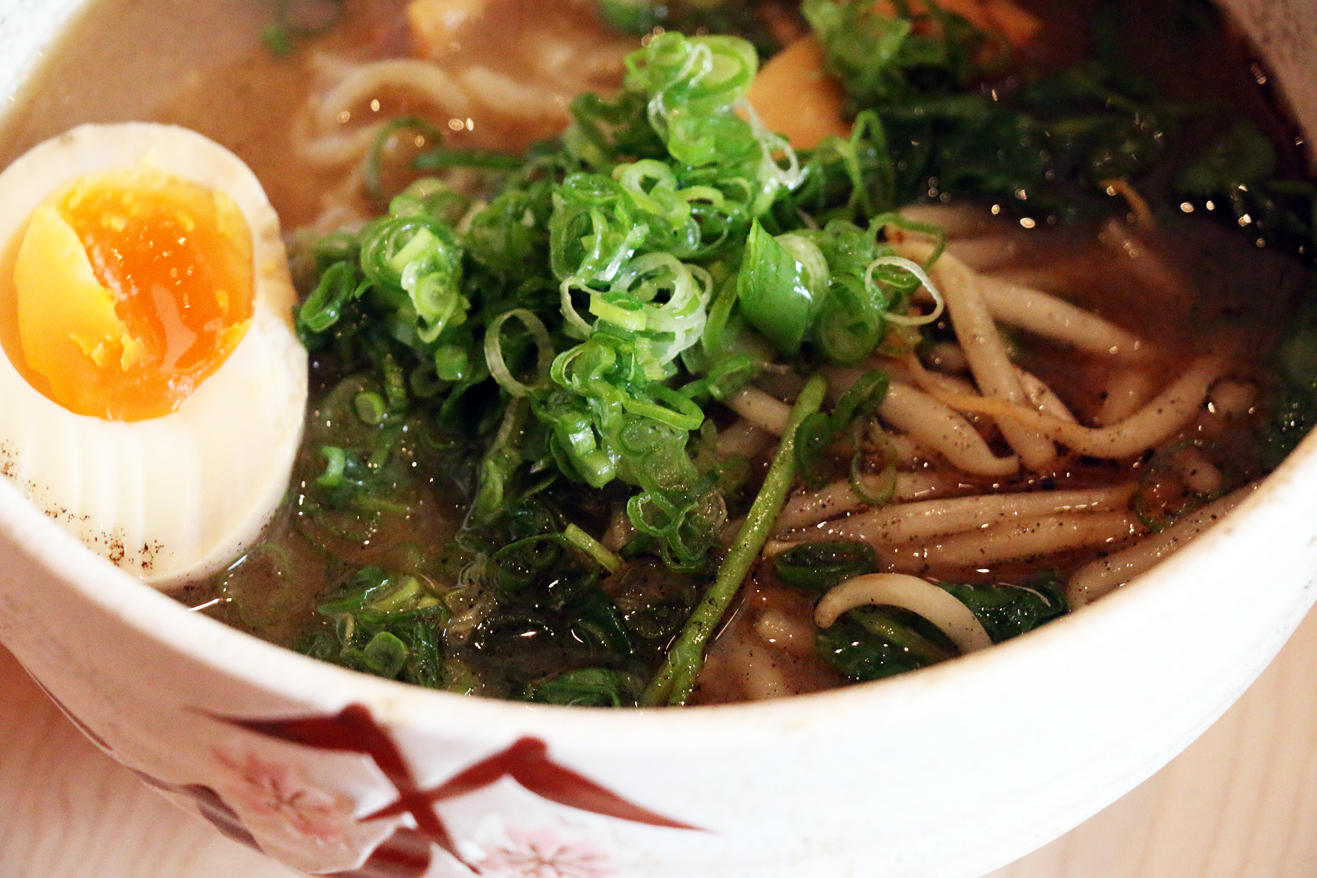 Miso ramen with watercress, bamboo shoots, bean sprouts and black garlic oil.