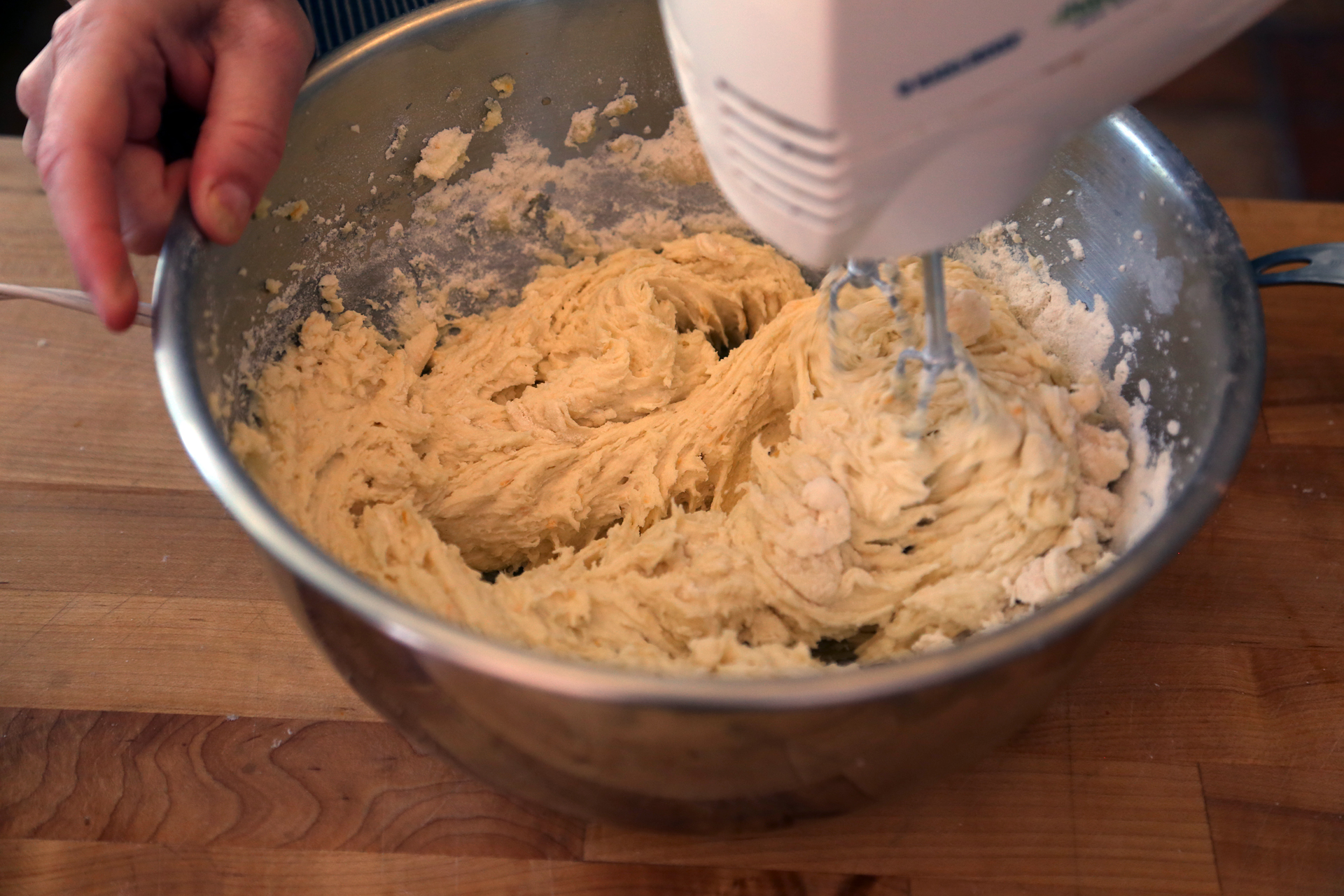 Using a handheld mixer or a stand mixer with the paddle attachment make the cake batter.