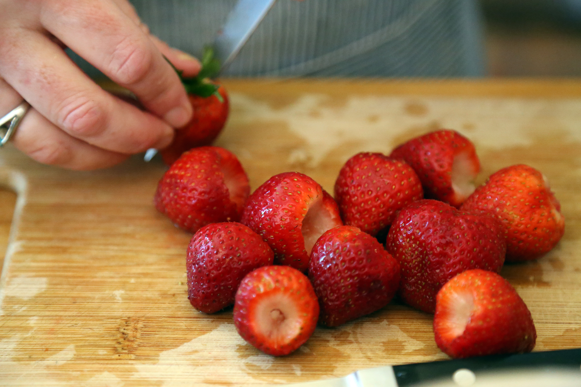 Hull the strawberries by removing the stem with a paring knife.
