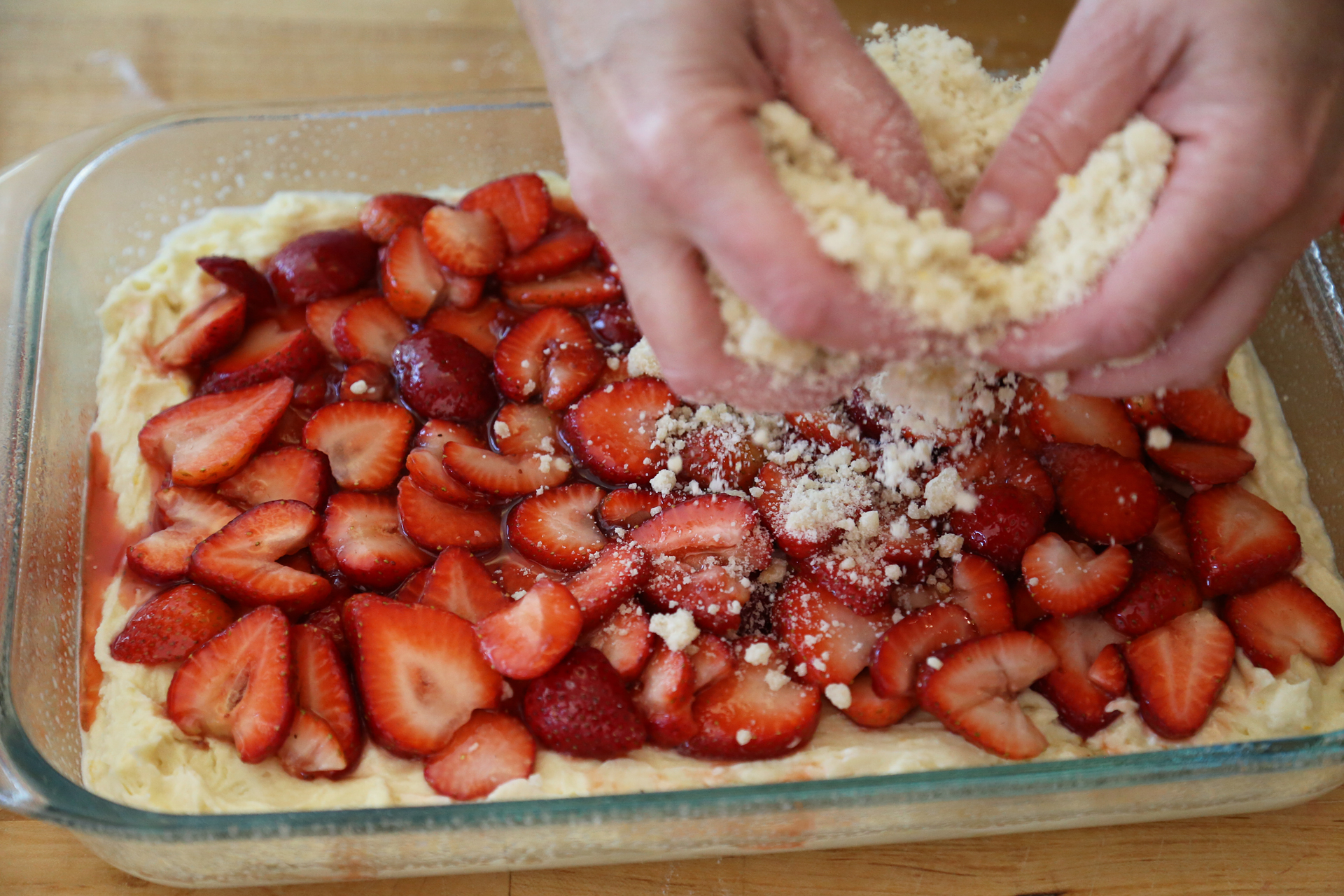 Sprinkle the streusel evenly over the strawberries.